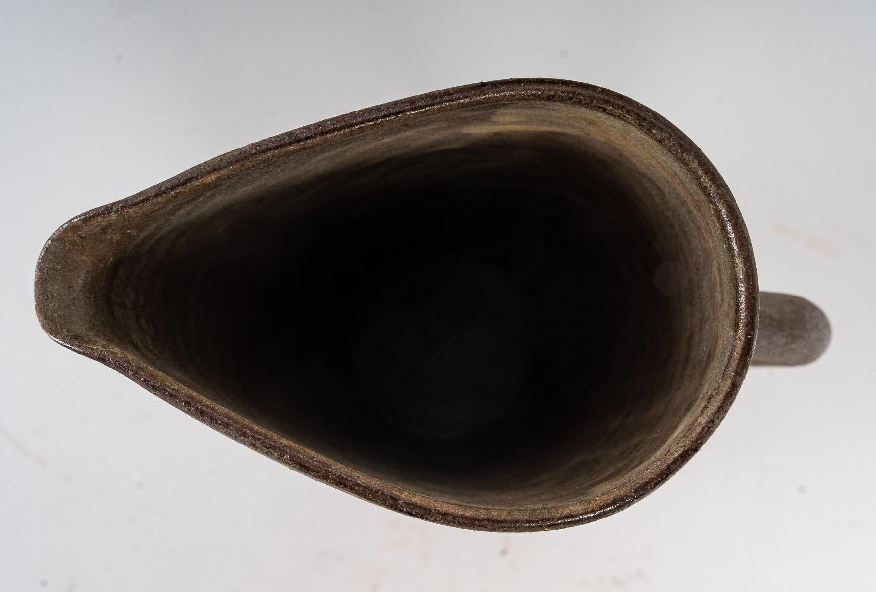 Ceramic pitcher by Alexandre Kostandd

Ceramic of Biot, pitcher by Alexandre Kostandd, 1950-1960.

Dimensions: H: 21cm, W: 14cm, D: 7cm.