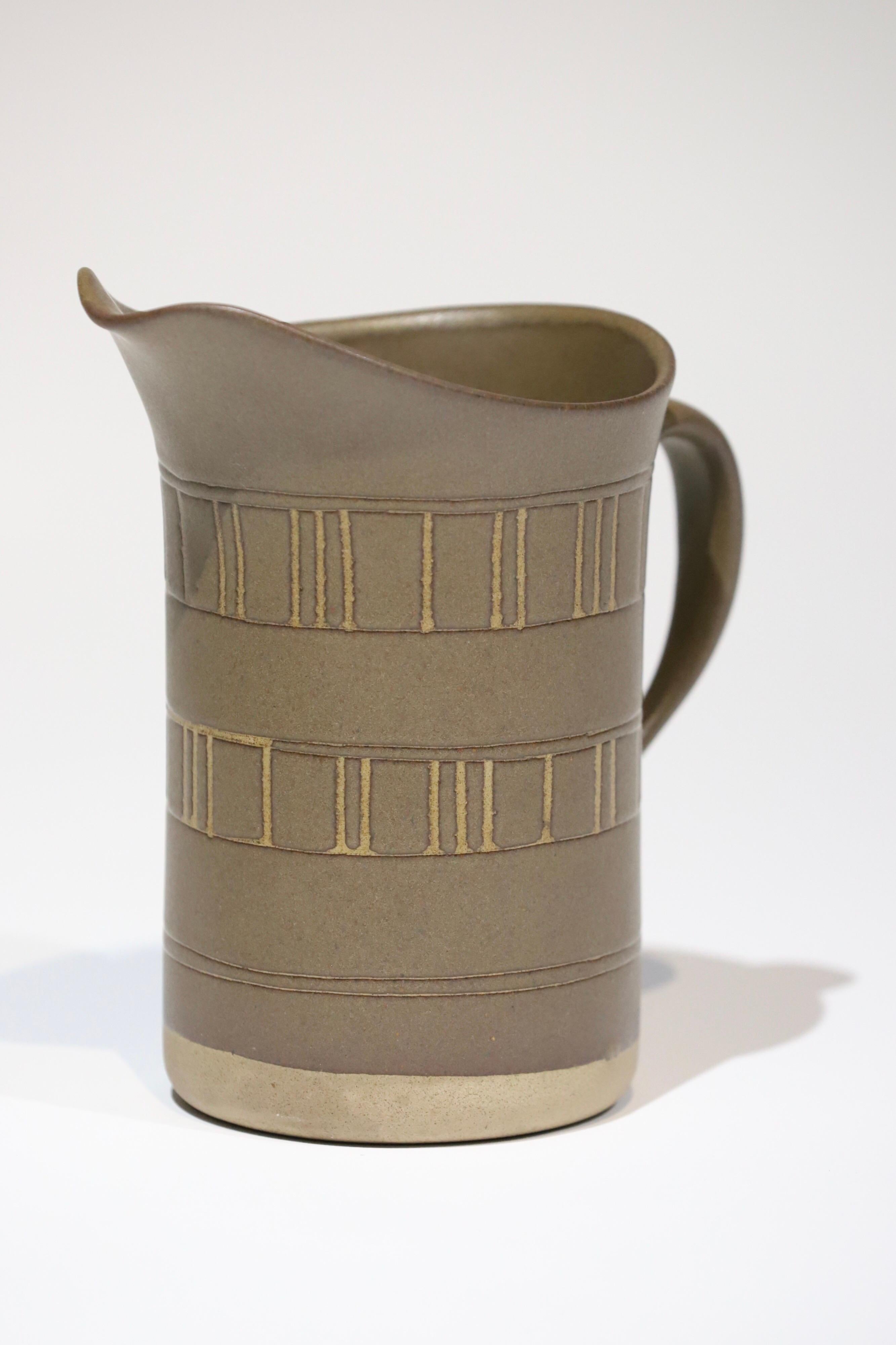 Excellent matte finish ceramic pitcher by Gordon and Jane Martz, Marshall studio. Signed. Pictured with Saarinen tulip side table and Peter Opsvik rocking chair for scale.