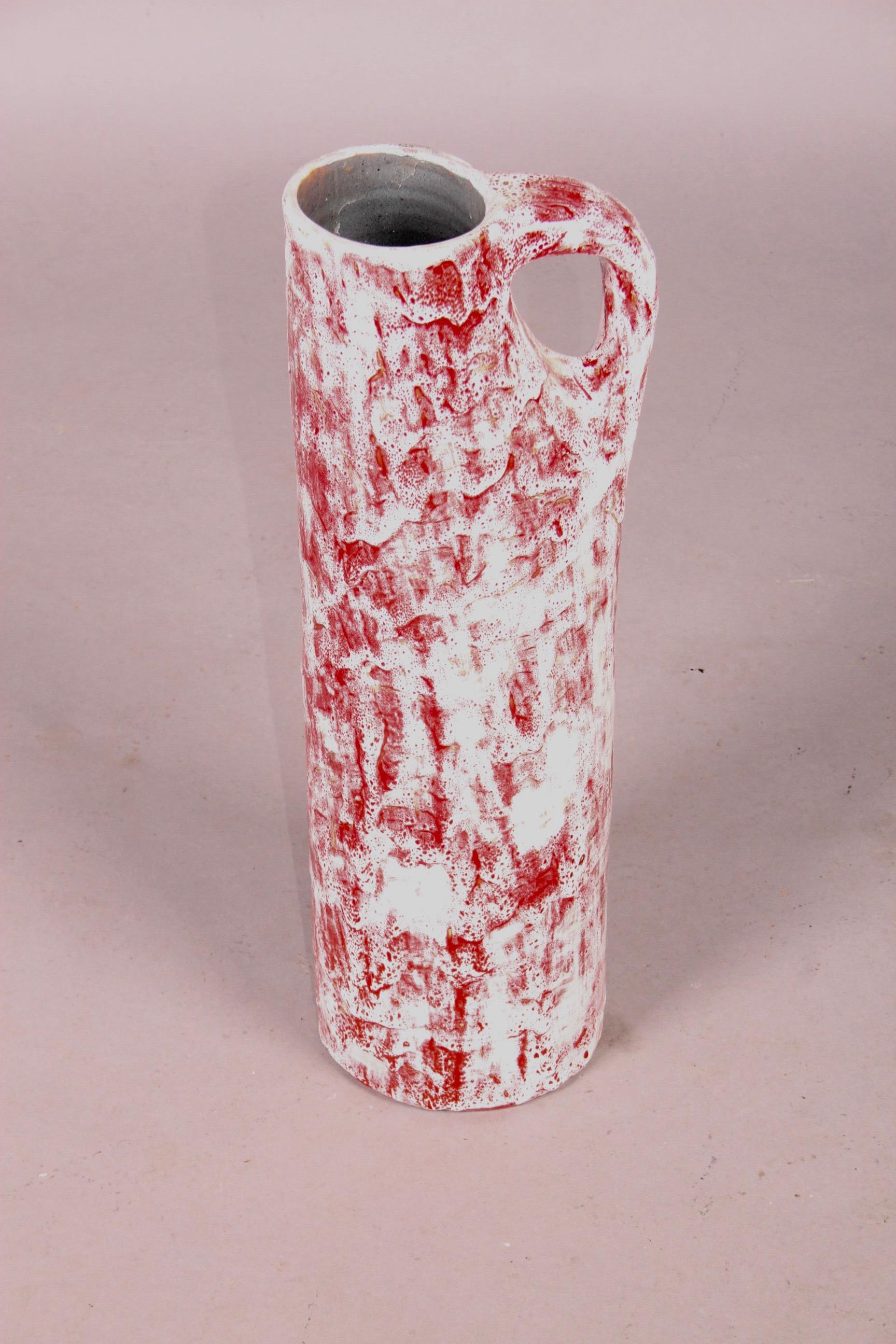 Ceramic pitcher by J, Linsig.