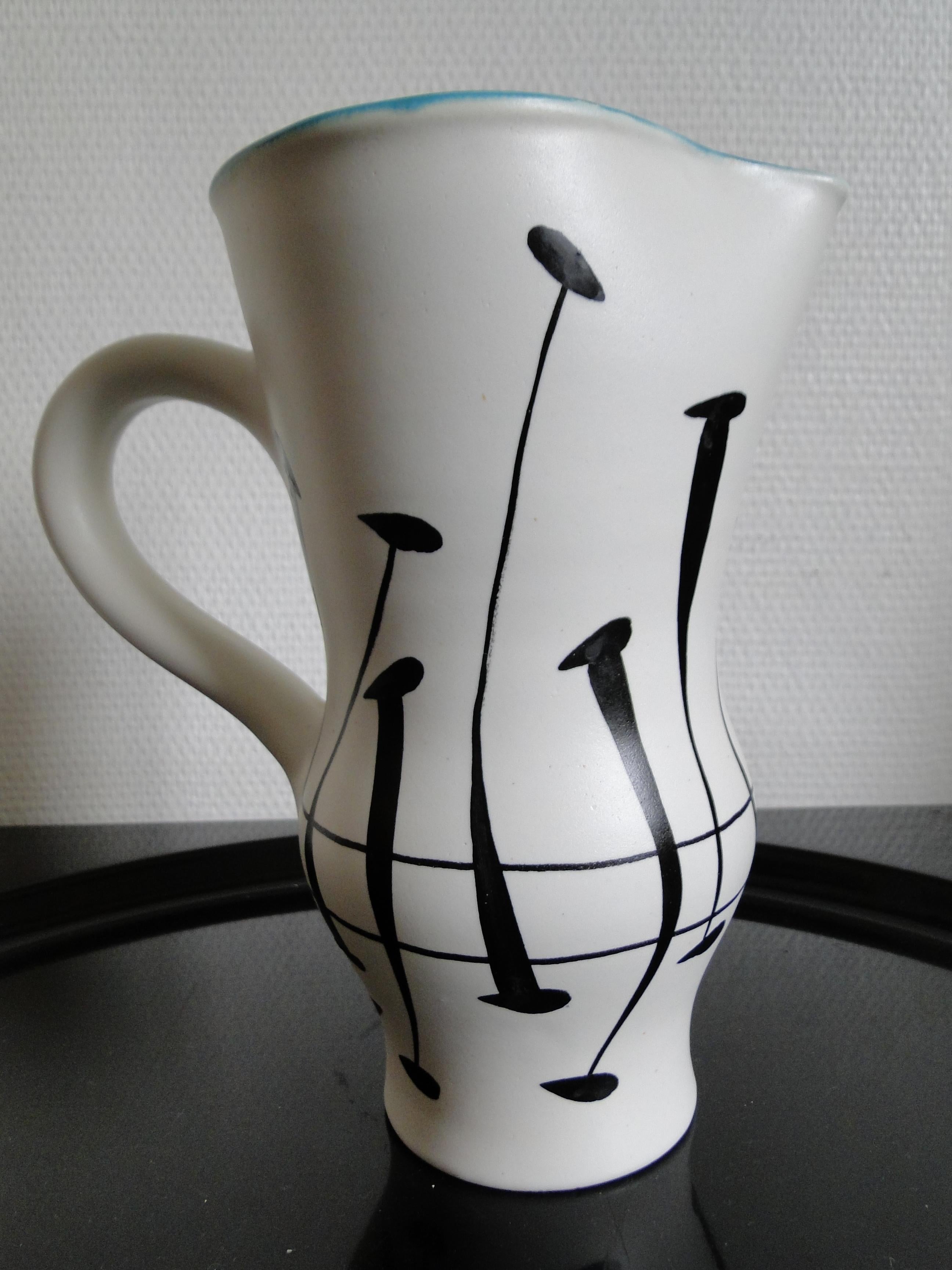 A large ceramic pitcher or jug,
thick white enamel with black decoration.
Roger Capron,
Vallauris
France circa 1960.
Signed 