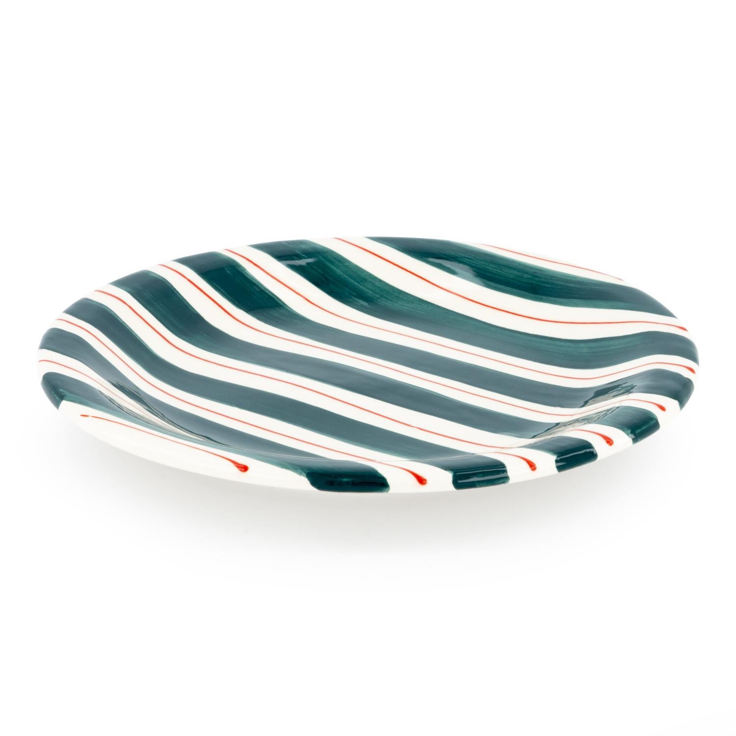 Something to elevate your dining experience! Add a touch of color to your table with our hand-painted ceramic striped bowl, featuring vibrant green and red accents on a white ceramic base. This piece is not only a perfect accessory for any meal, but