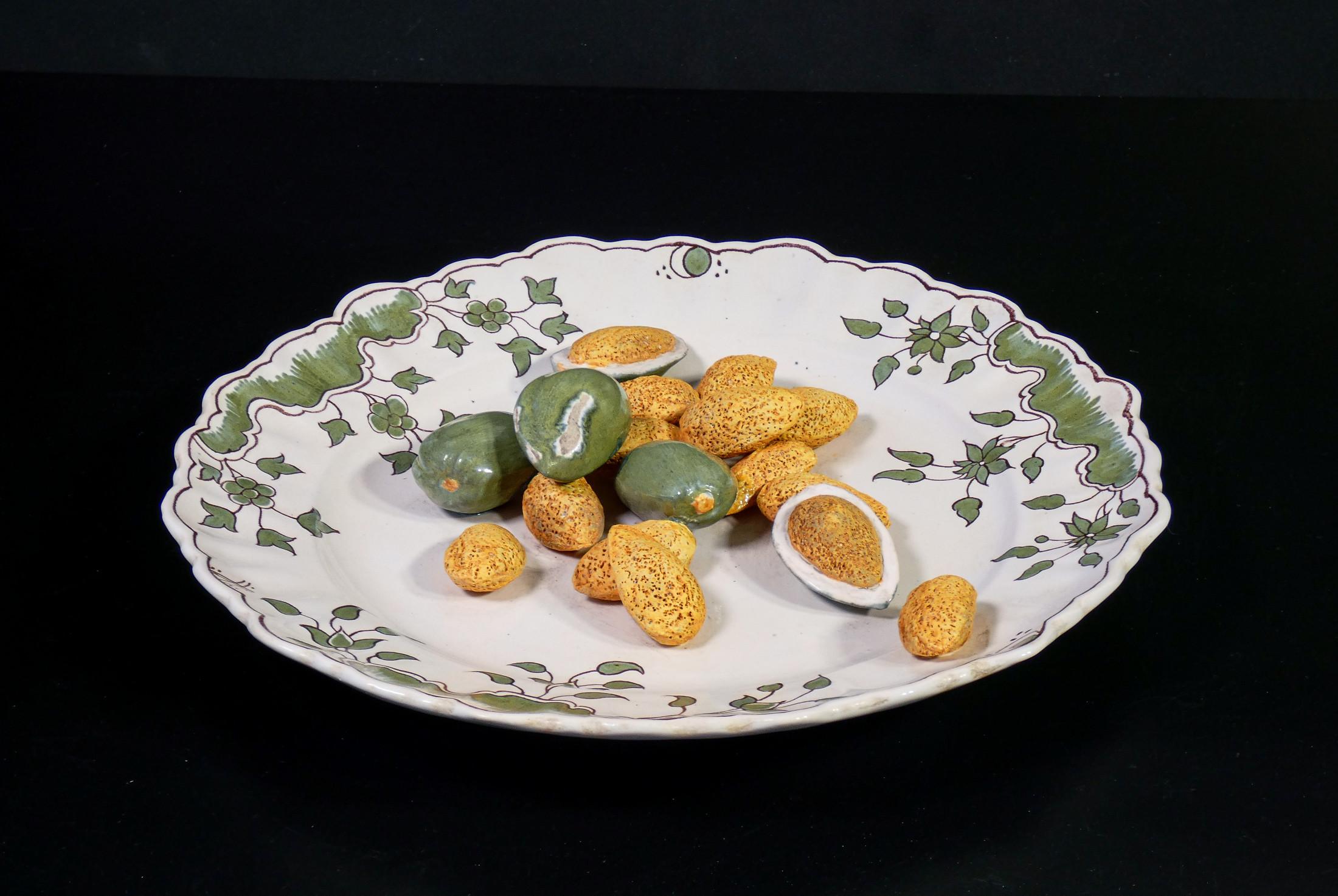 Ceramic plate by
MOUSTIERS
with almonds sculpture.
Hand painted.

ORIGIN
France

PERIOD
Late nineteenth century,
early twentieth century

BRAND
Manufacture of Moustiers

MATERIALS
Hand modeled and painted ceramic

DIMENSIONS
Ø