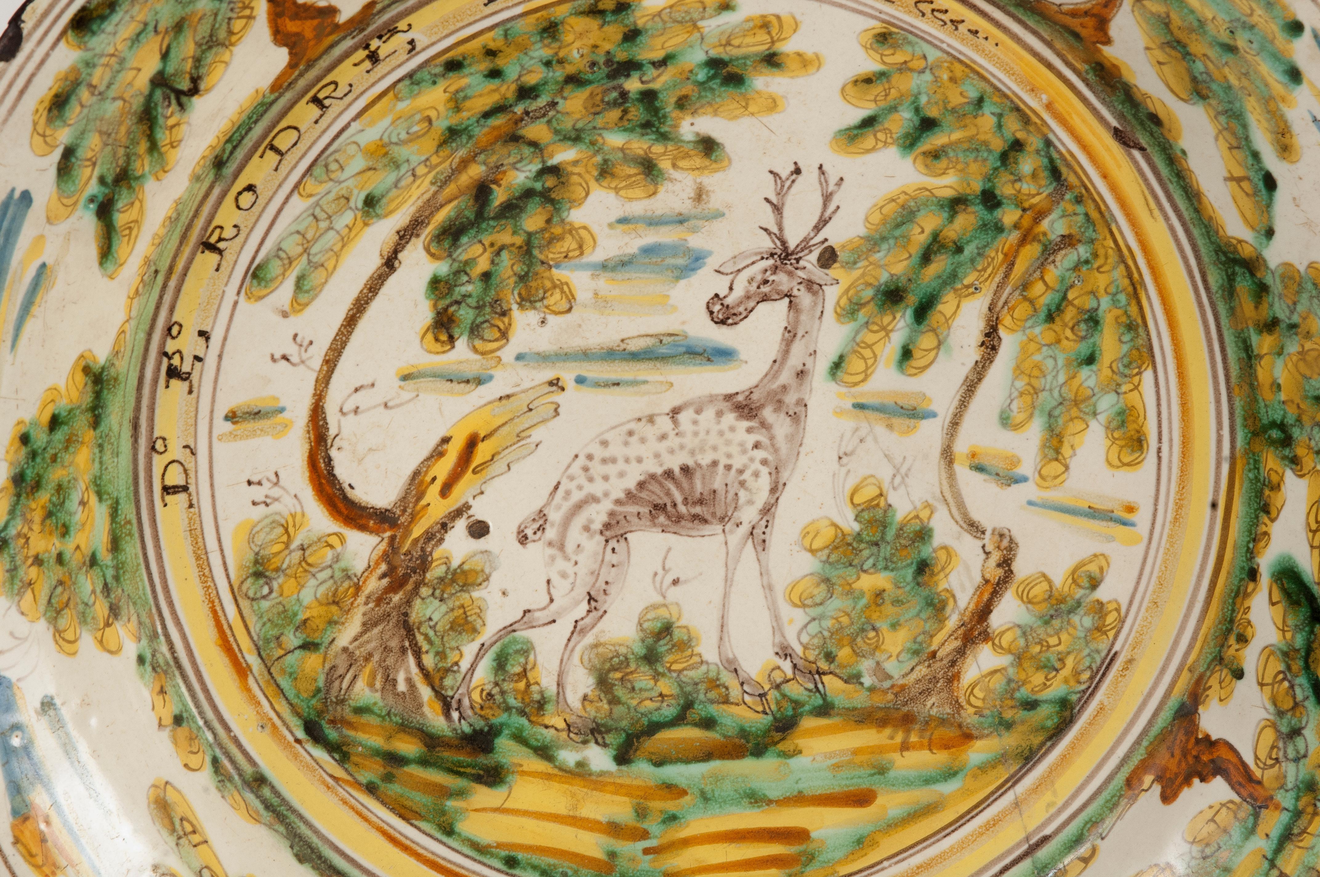 Ceramic plate decorated with high temperature enamels on a white tin opaque slip. The polychromy is based on typical Talavera colors: cobalt blue, copper green, manganese black, antimony yellow and ochres, browns and iron oranges. These enamels were