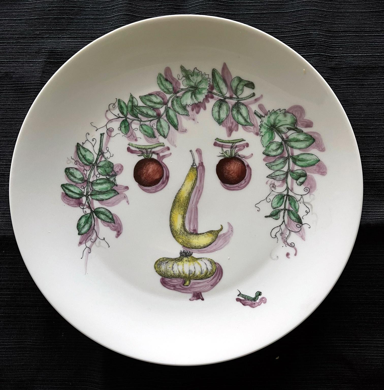 Fornasetti Porcelain plate with face made with arranged vegetables. Stamped 