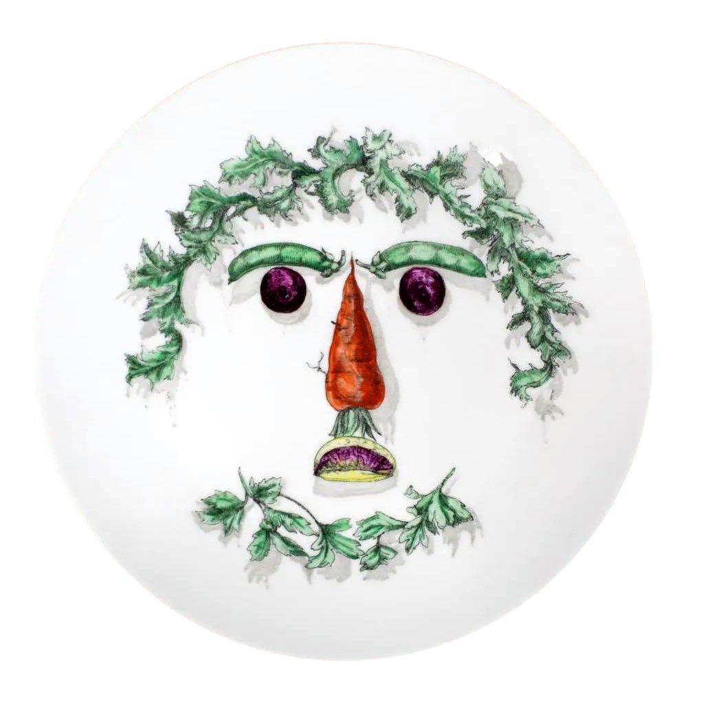 Assiette en céramique avec visage végétal Fornasetti