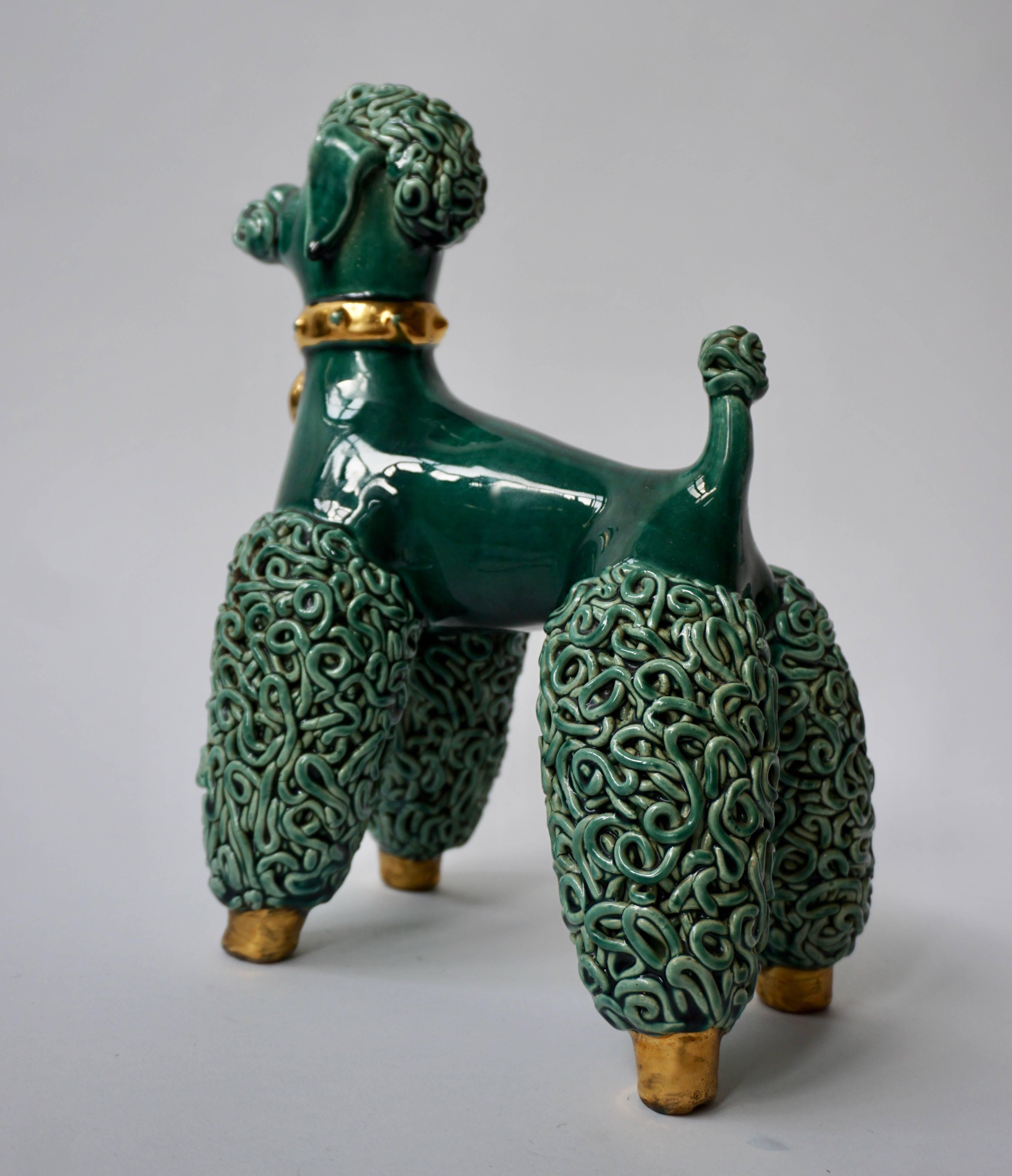 A midcentury ceramic porcelain 'Spaghetti' poodle dog sculpture.
Poodle dog's have traditional poodle cut, stance, detail face (eyes, nose, tongue) and gold collar. 
Measures: Height 28 cm.
Width 26 cm.