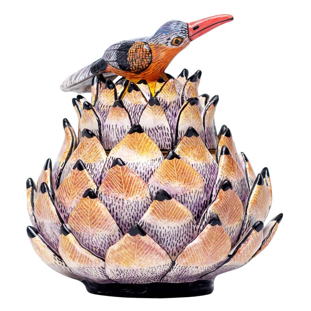 Protea, Bird Jewelry Box Hand Painted by Jabu and Sculpted by Sfiso from Love Art Ceramic

The Protea, Bird Jewelry Box is a remarkable piece of ceramic art that captures the vibrant spirit of South Africa, crafted in 2024 by the talented artists