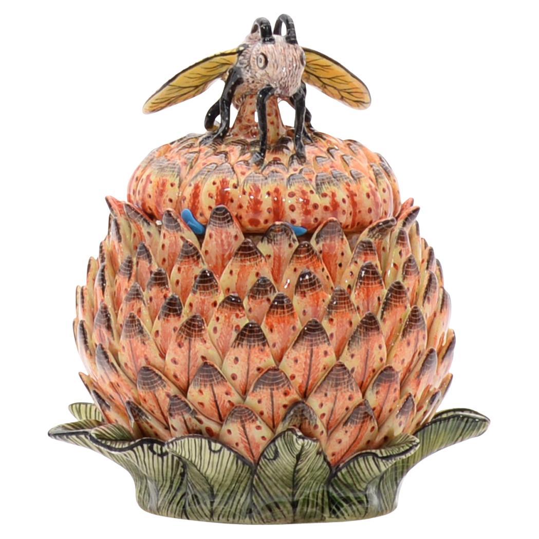Protea Wasp Jewelry Box
Hand Painted by Winnie Mchunu and Sculpted by Nathi

The Protea Wasp Jewelry Box is a captivating piece of ceramic art crafted by the talented artists Winnie Mchunu and Nathi at Love Art Ceramic in South Africa. Standing at 6
