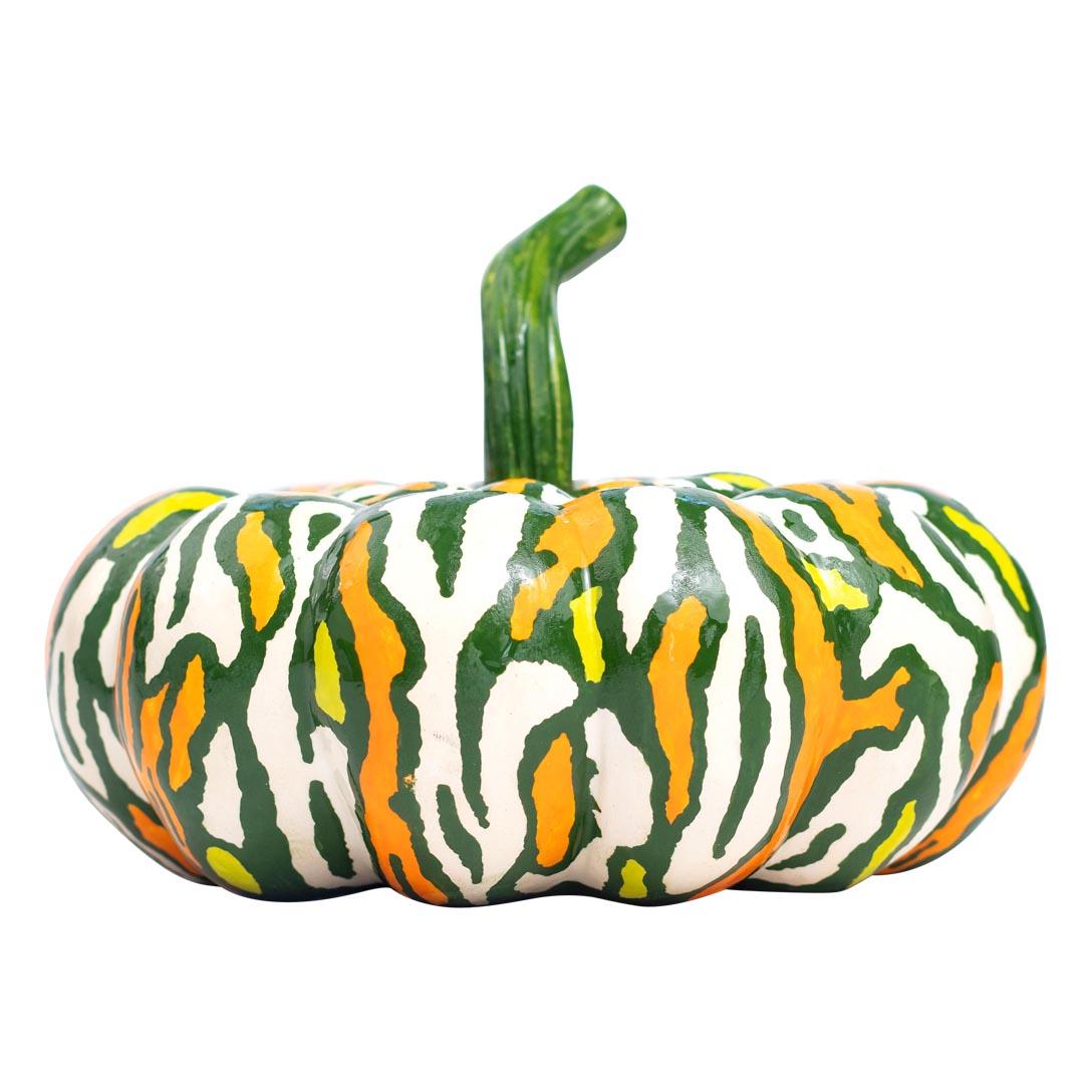 This stunning ceramic pumpkin box, crafted by Love Art Ceramics in South Africa, showcases the talents of two skilled artists. Made entirely by hand, this special piece features a removable lid for convenient storage. With a vibrant array of colors