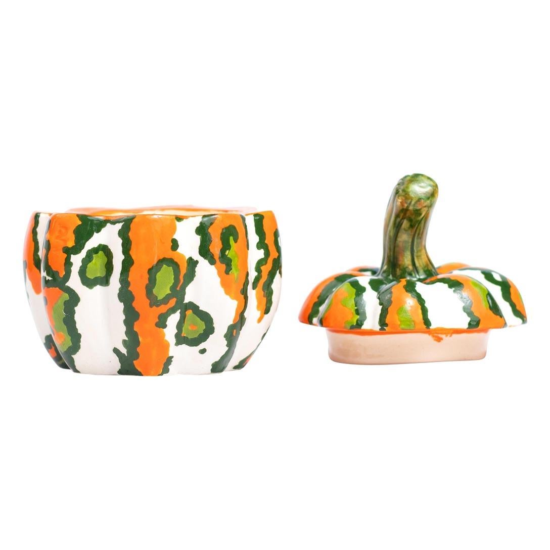 This charming ceramic pumpkin jewelry box is a unique, one-of-a-kind piece handcrafted in South Africa by Love Art Ceramics. Made entirely by hand without the use of molds, it features vibrant orange, white, and green colors, all coated in a glossy