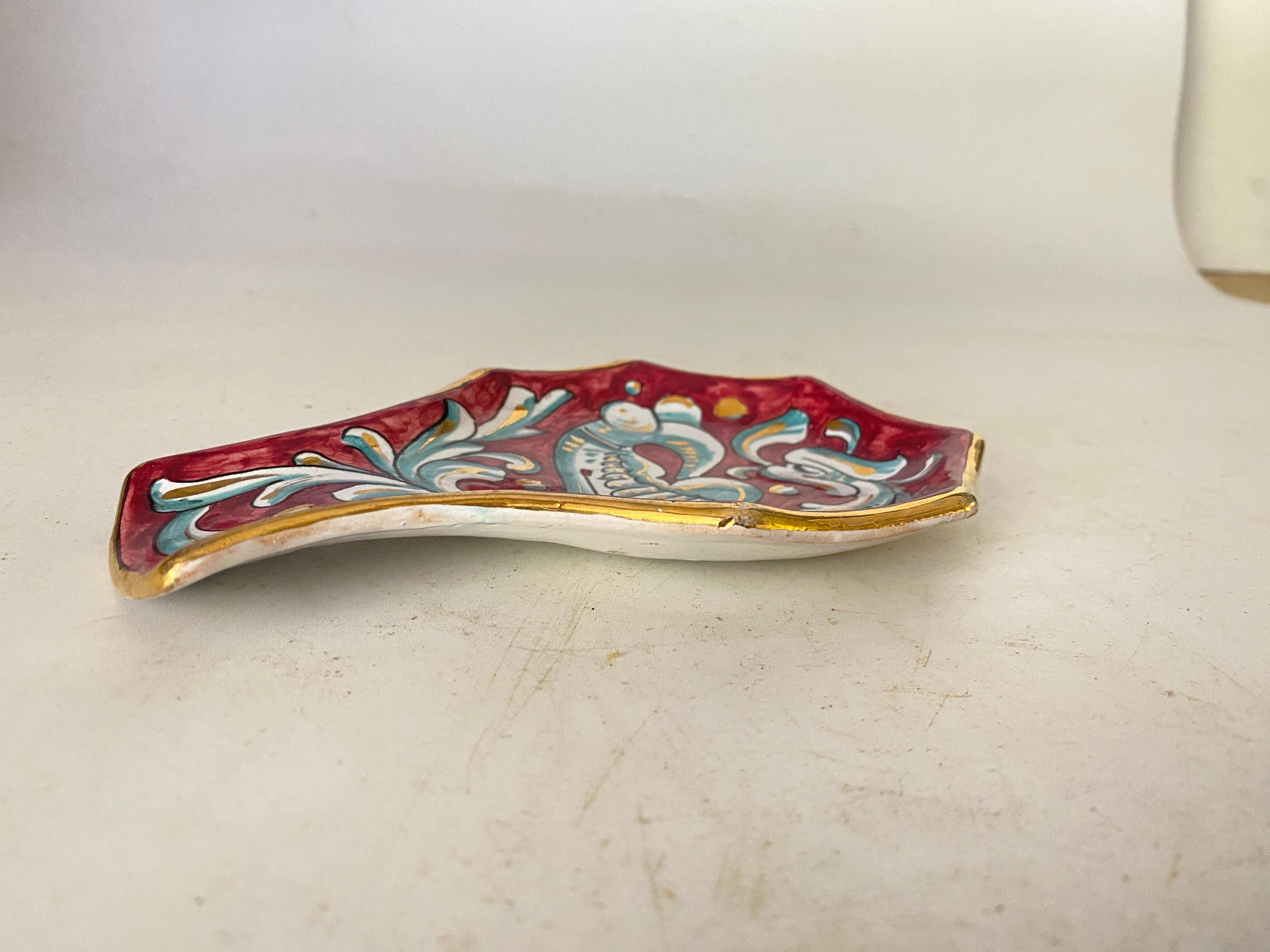 This Ceramic Ashtray or Vide Poche, has a shell Shape. The colors are the Red and white.
It has been made in Italy Circa 1960
