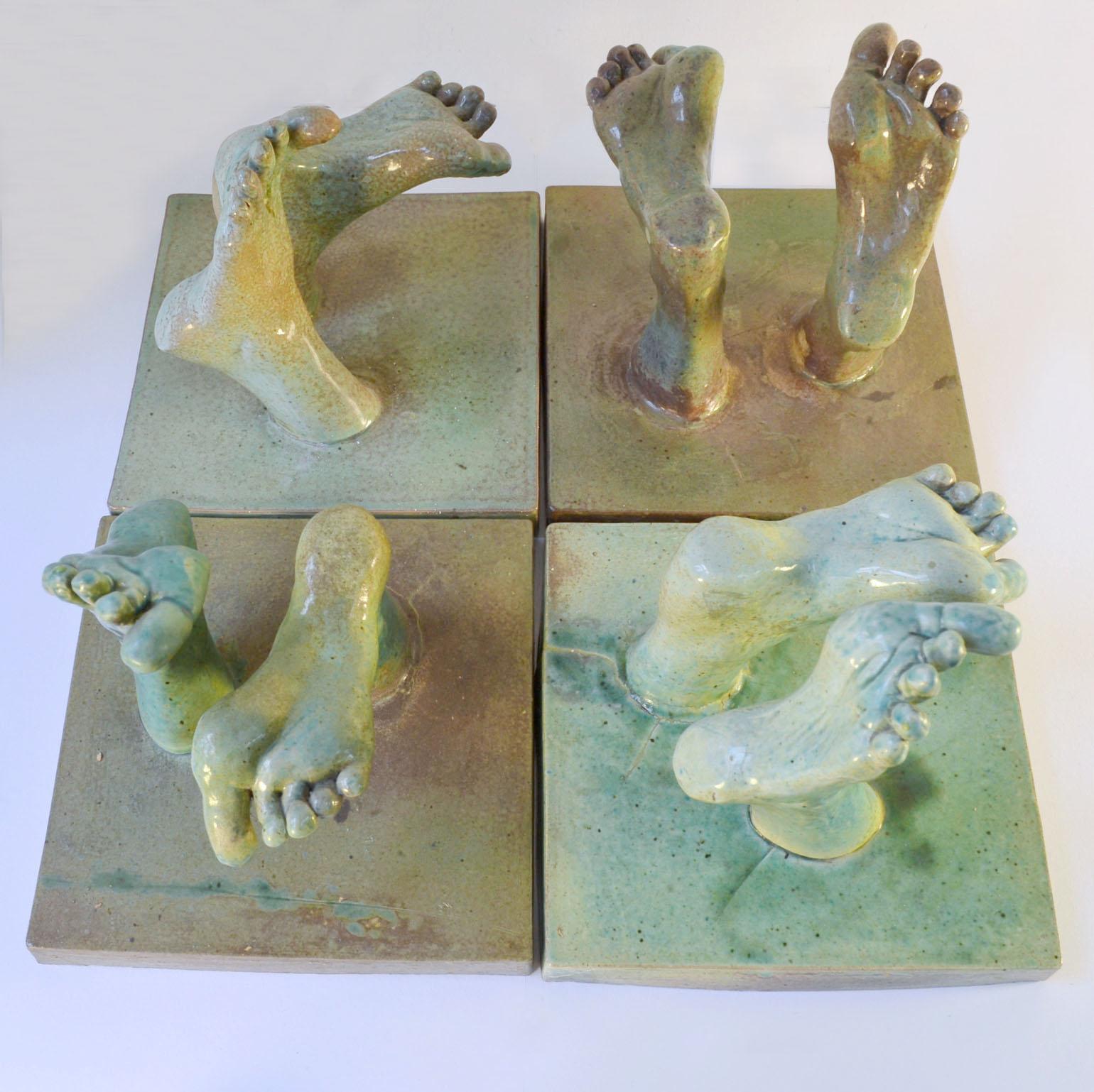 'Bergos' tapestry of feet consists four ceramic tiles made into a relief with feet walking upwards from the tile squares, by Lies Gronheid, 1978. Each tile has two feet cast in ceramic and mounted on the tiles. The green glaze varies from tile to