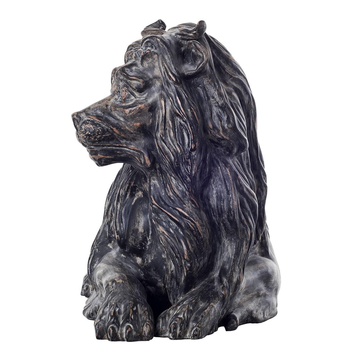 Ceramic reproduction of lying down lion.
This magnificent lion reproduction depicts the king of the beasts surveying his subjects, proudly relaxed in a classic pose.
The fine detailing of this dark finished lion sculpture showcases the wavy curls