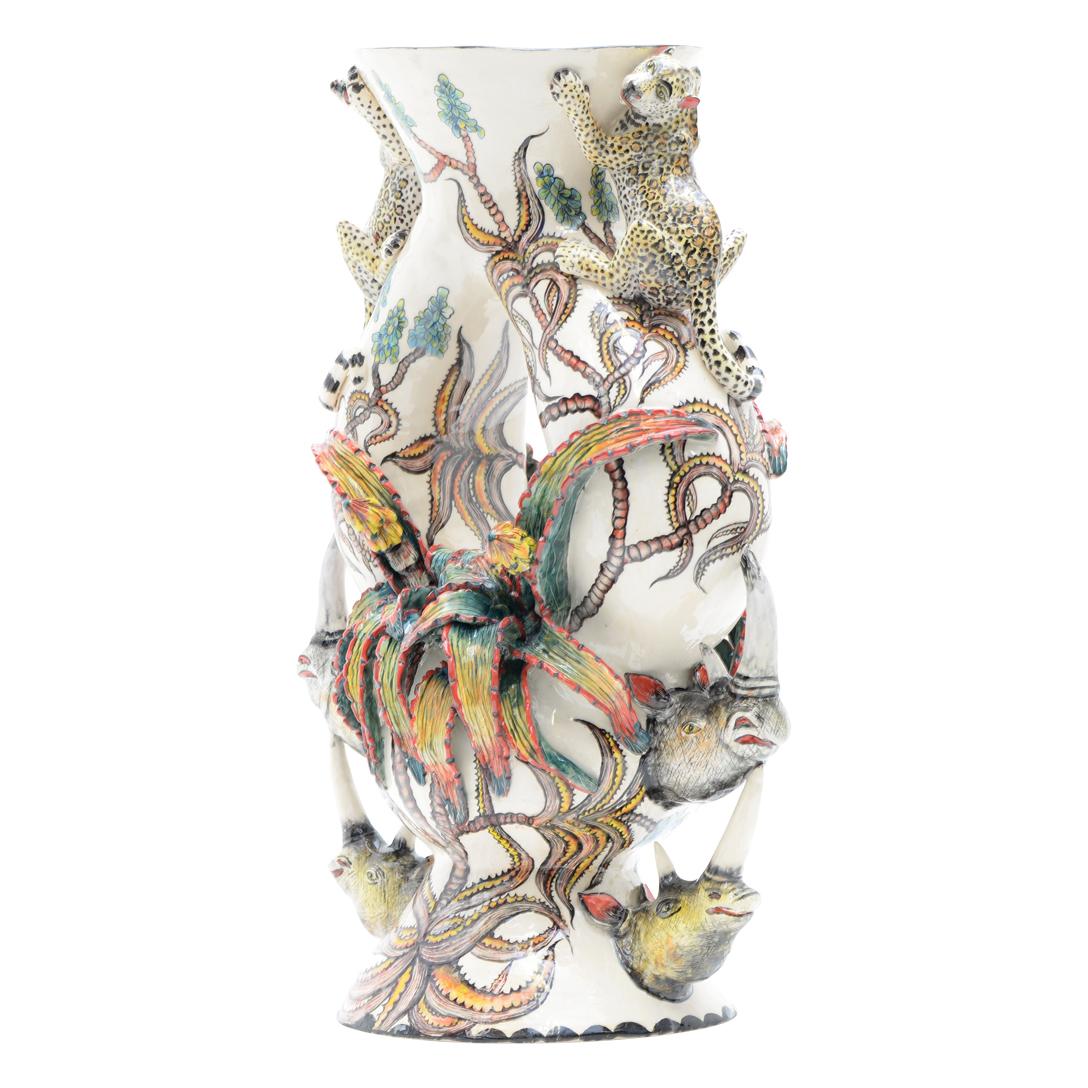The Rhino aloe vase was designed by Zimele Original Ceramics in South Africa.Hand painted by Lindy Hand sculpted by Victor & Sello.The African Circus collection, in Victor's words: 
This collection was inspired by my observations of wildlife and
