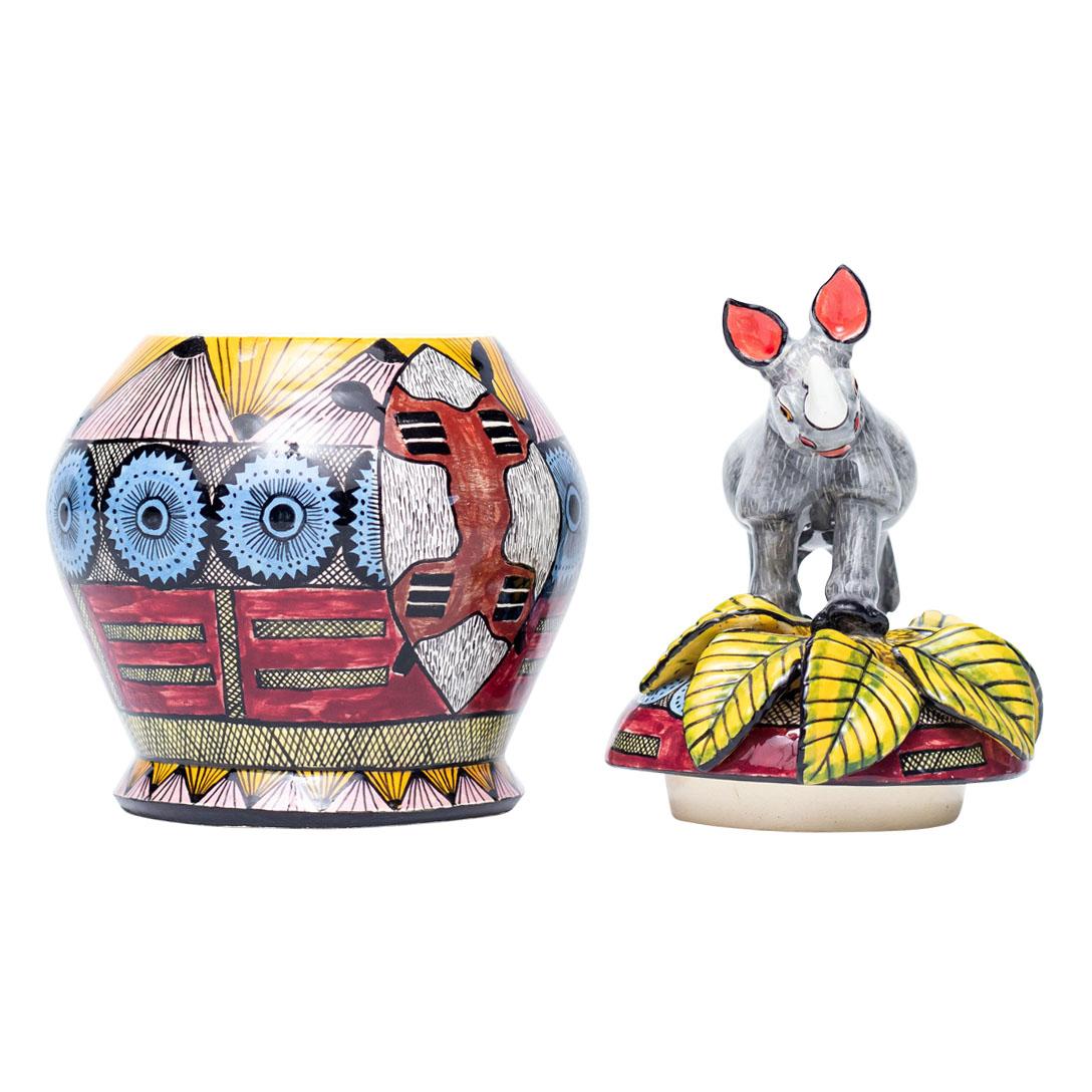 Rhino Jewelry Box Hand Painted by Slie and Sculpted by Sbusiso
Celebrate the beauty of South African wildlife with the captivating Rhino Jewelry Box, a stunning ceramic piece crafted by Love Art Ceramic. Sculpted by the talented Sbusiso and