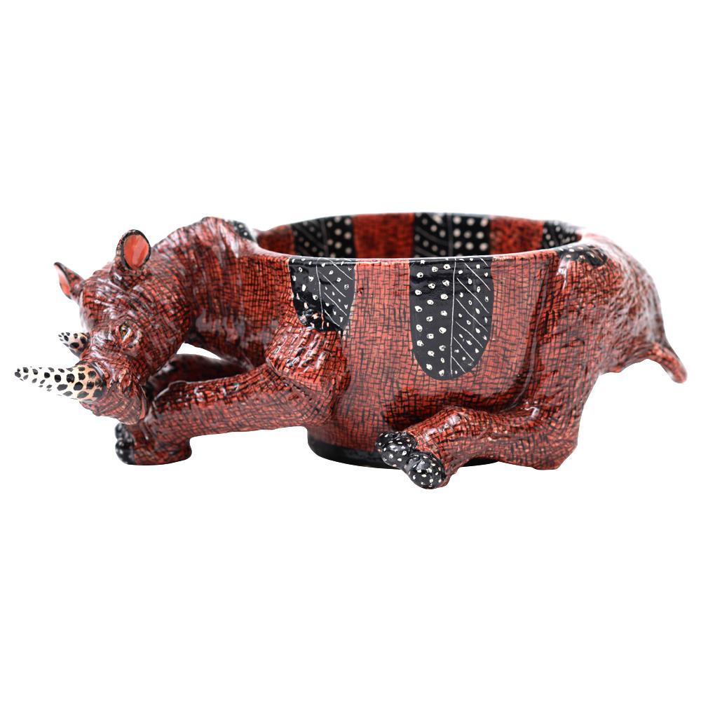 Rhino Peanut Bowl Hand-Painted by Jabu Nene and Sculpted by Sondelani Ntshalintshali

The Rhino Peanut Bowl from Love Art Ceramic is a delightful fusion of functionality and artistry, embodying the spirit of South Africa's rich wildlife. Standing 9