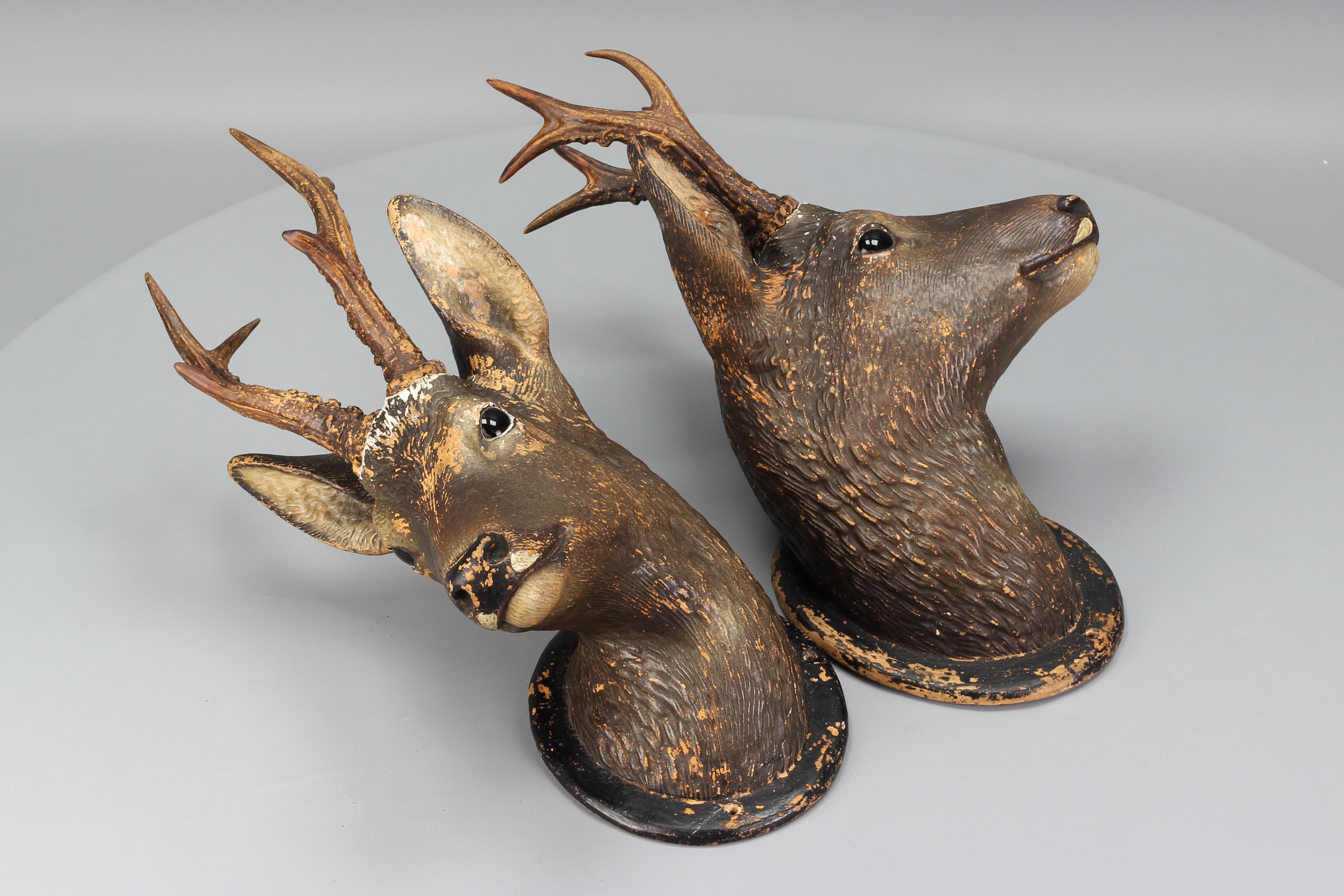Ceramic Roe Deer Heads, wall decoration, Germany, 1930s, Set of Two.
An absolutely adorable pair of roe deer heads in the Black Forest style is made entirely of ceramic and hand-painted in brown and black colors. The antlers of both deer heads are