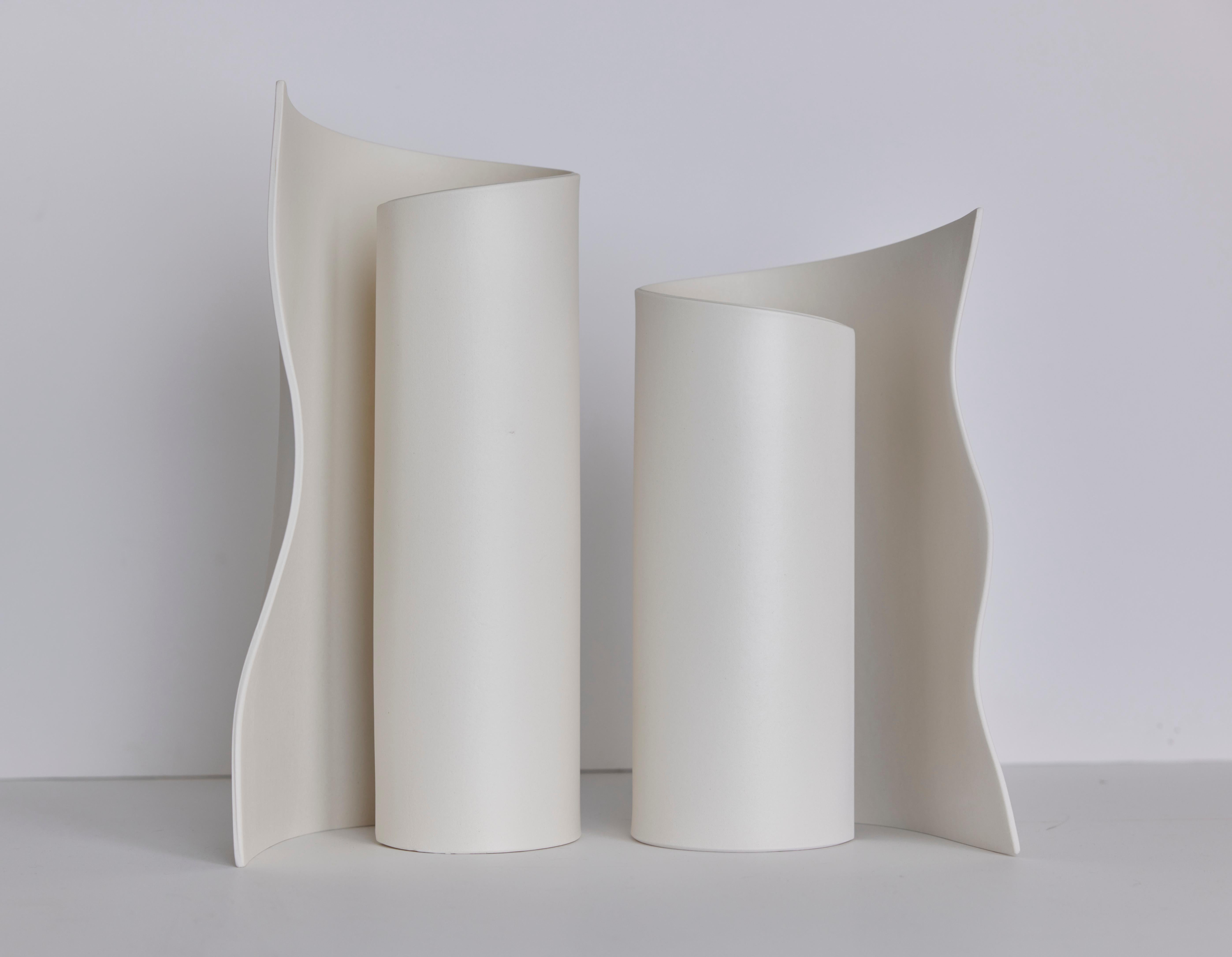 The Scroll Luminaires are Ceramic Table Lamps, made by Olivia Barry, by hand. The folded shape of the white earthenware wing hides the light source while allowing the ambient light to project onto the matte finished wing.

Custom dimensions