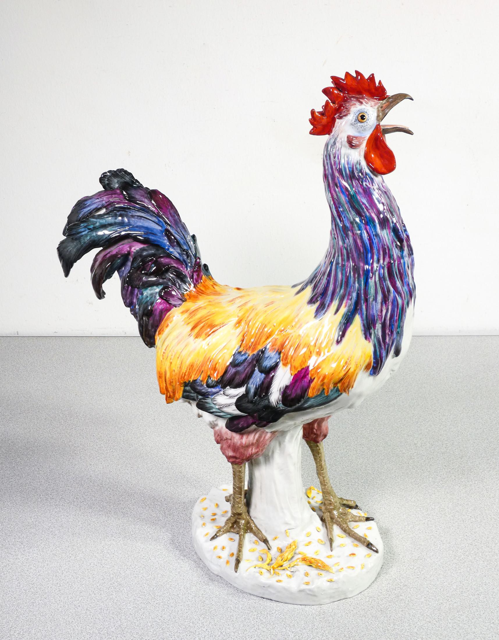 Ceramic sculpture
Rooster,
by Kalk Porcelain factory

Origin 
Germany

Period
Early 20th century

Brand
KALK Porcelain factory

Model
Rooster

Material
Hand modeled and painted porcelain

Dimensions
H 49 cm
37 x 15