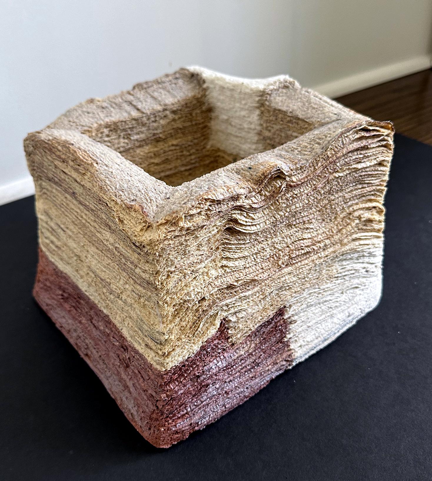 A highly unique ceramic sculpture by South Korean artist Jongjin Park (1982-). The square-form piece is boundary-pushing and defies both the traditional function of a vessel and the very definition of ceramic. The artist developed a creative method