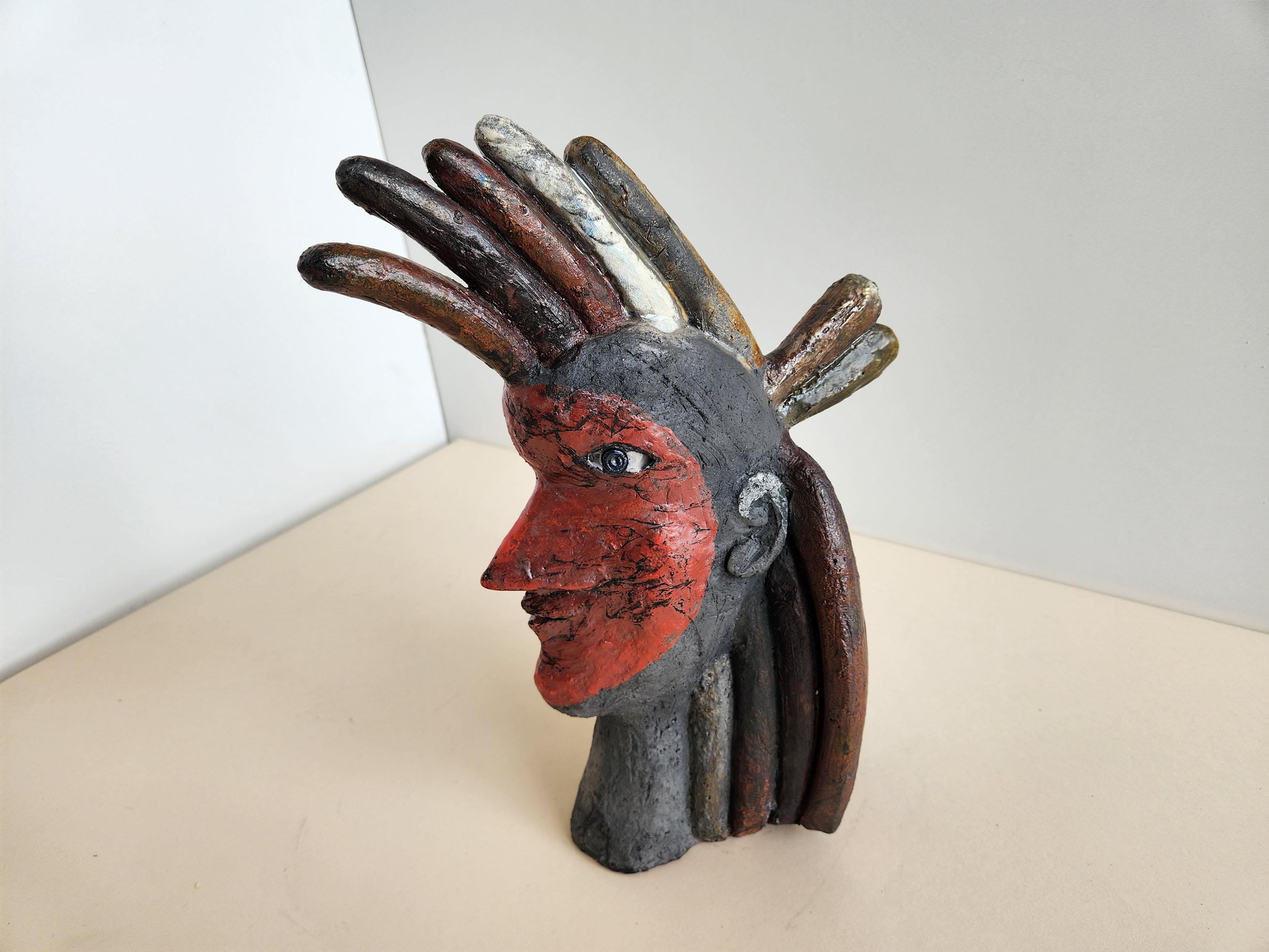 Vintage ceramic sculpture of Indian head by Roger Capron.
Signed by Capron Vallauris, France.

Roger Capron was in influential French ceramicist, known for his tiled tables and his use of recurring motifs such as stylized branches and geometrical