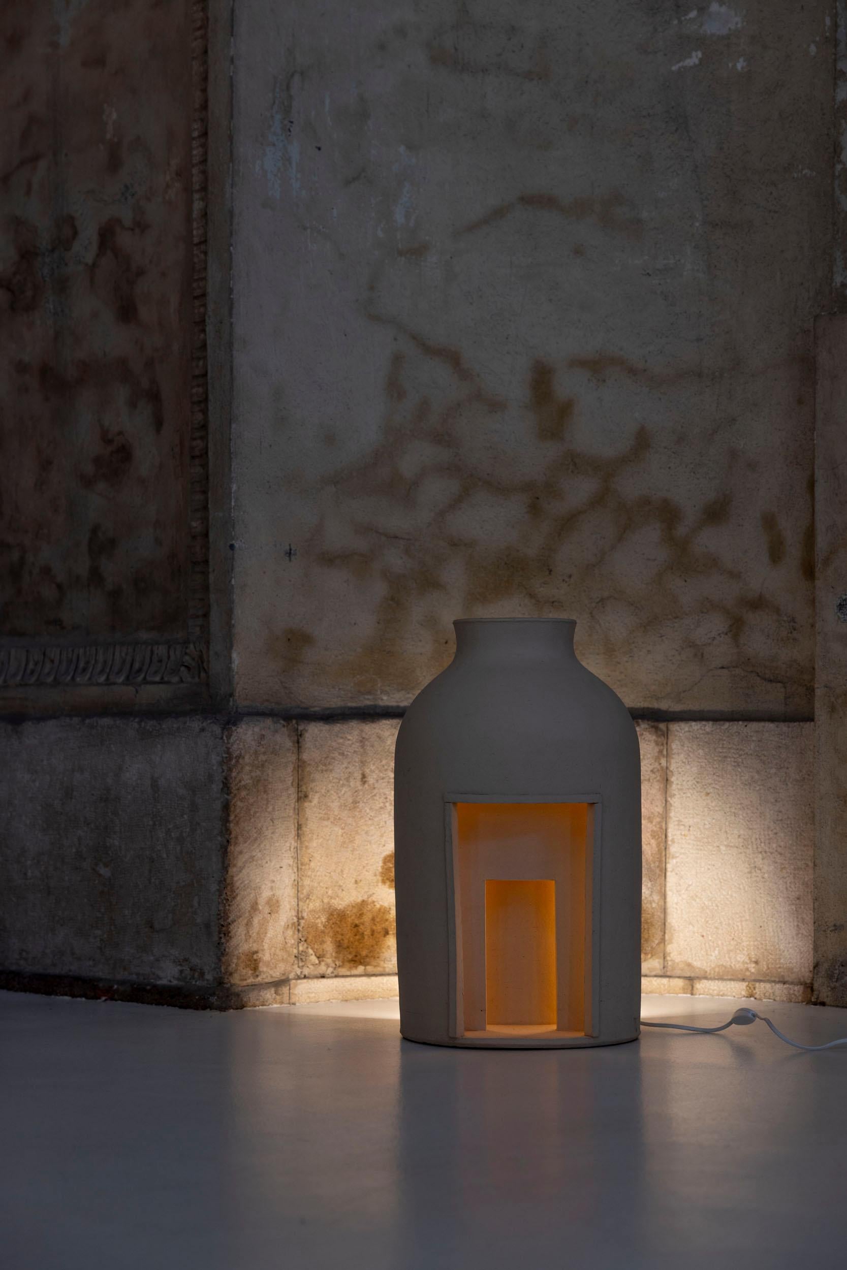 Mistero Lamp, a sculptural ceramic lamp crafted using the coiling technique, featuring warm light that glows through multiple portals, creating a dance of illumination.
Tonino Negri, born in Lodi in 1961, is a renowned sculptor and ceramicist. His