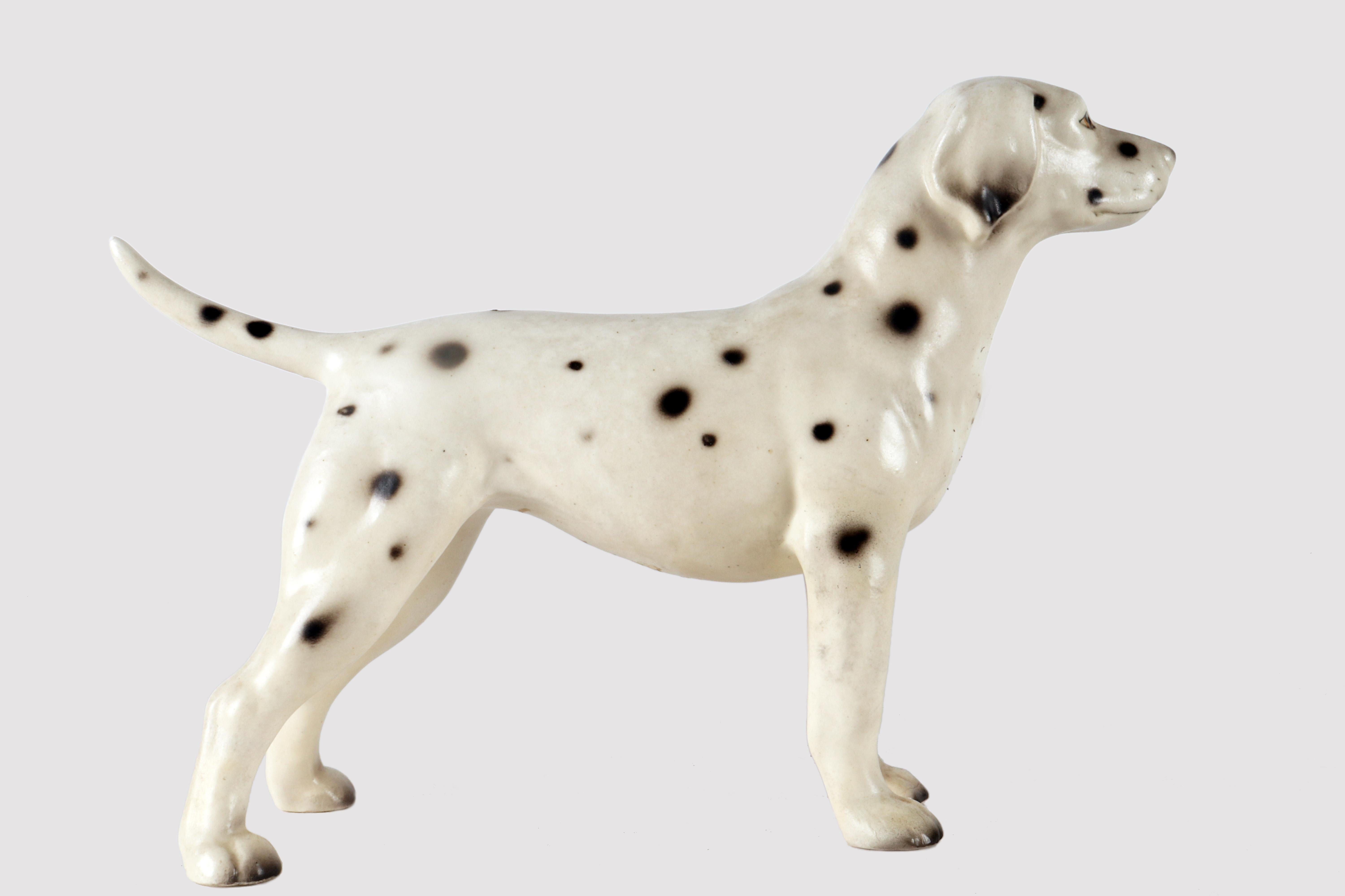 Painted ceramic sculpture depicting a Dalmatian dog. England circa 1950.