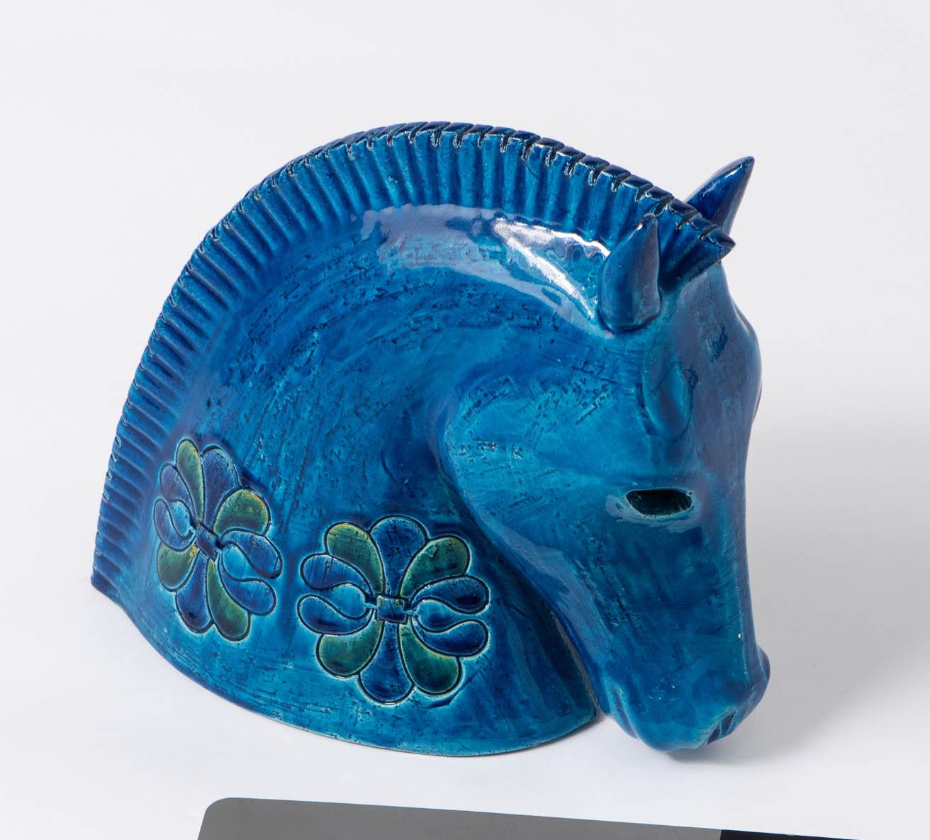 A large ceramic sculpture of a Horse’s Head by Aldo Londi for Bitossi.
“Rimini blue” glaze
With impressed stylized decoration.
Italy,
circa 1950.
Measures: 25 cm high x 27 cm deep x 10 cm wide.
 