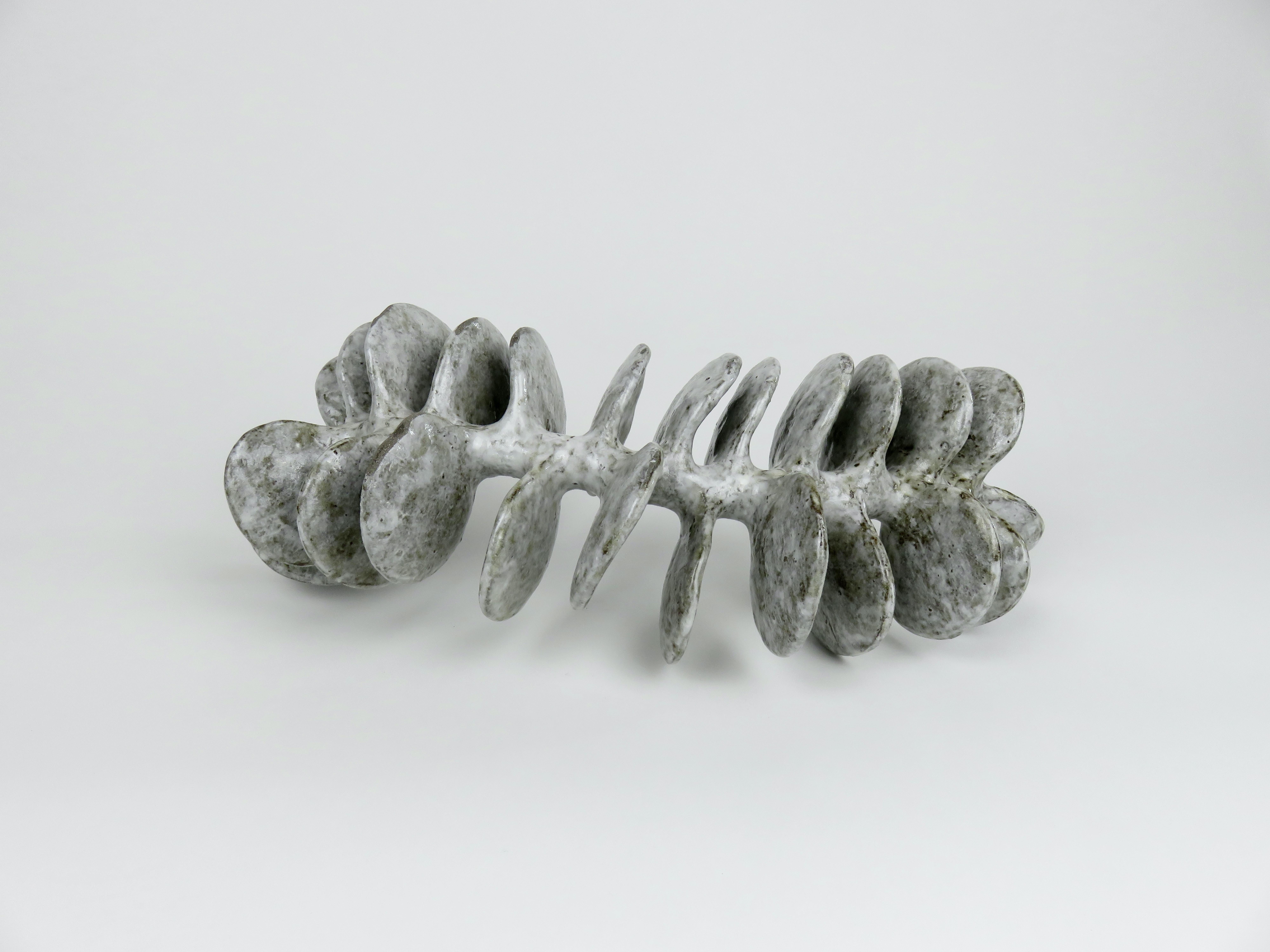 Ceramic Sculpture, Reclining Skeletal Spine in Mottled White and Brown For Sale 1