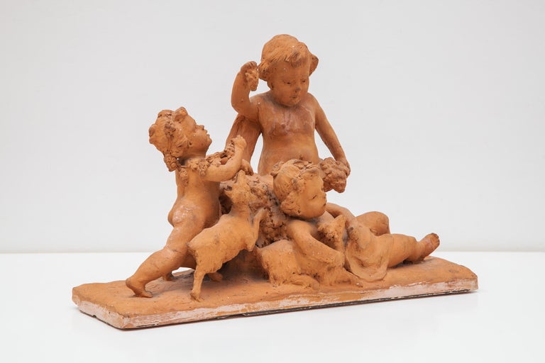 Folk Art Ceramic Sculpture with a Group of Playing Putti's 19th Century Belgium For Sale