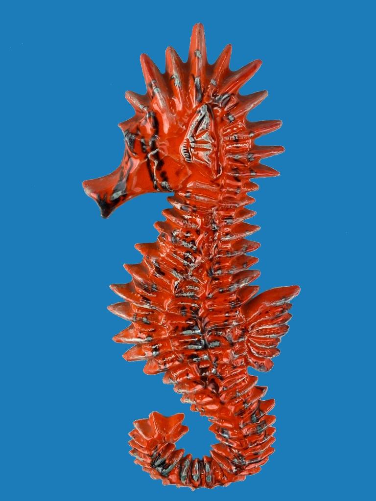 Stunning and cute ceramic Seahorse by Amphora Yann, Belgium. Nice glazed orange with subtile black, white and seablue streaks. 

Discover the timeless charm of this ceramic Seahorse wall sculpture from the 1960s. This cute sculpture is made by