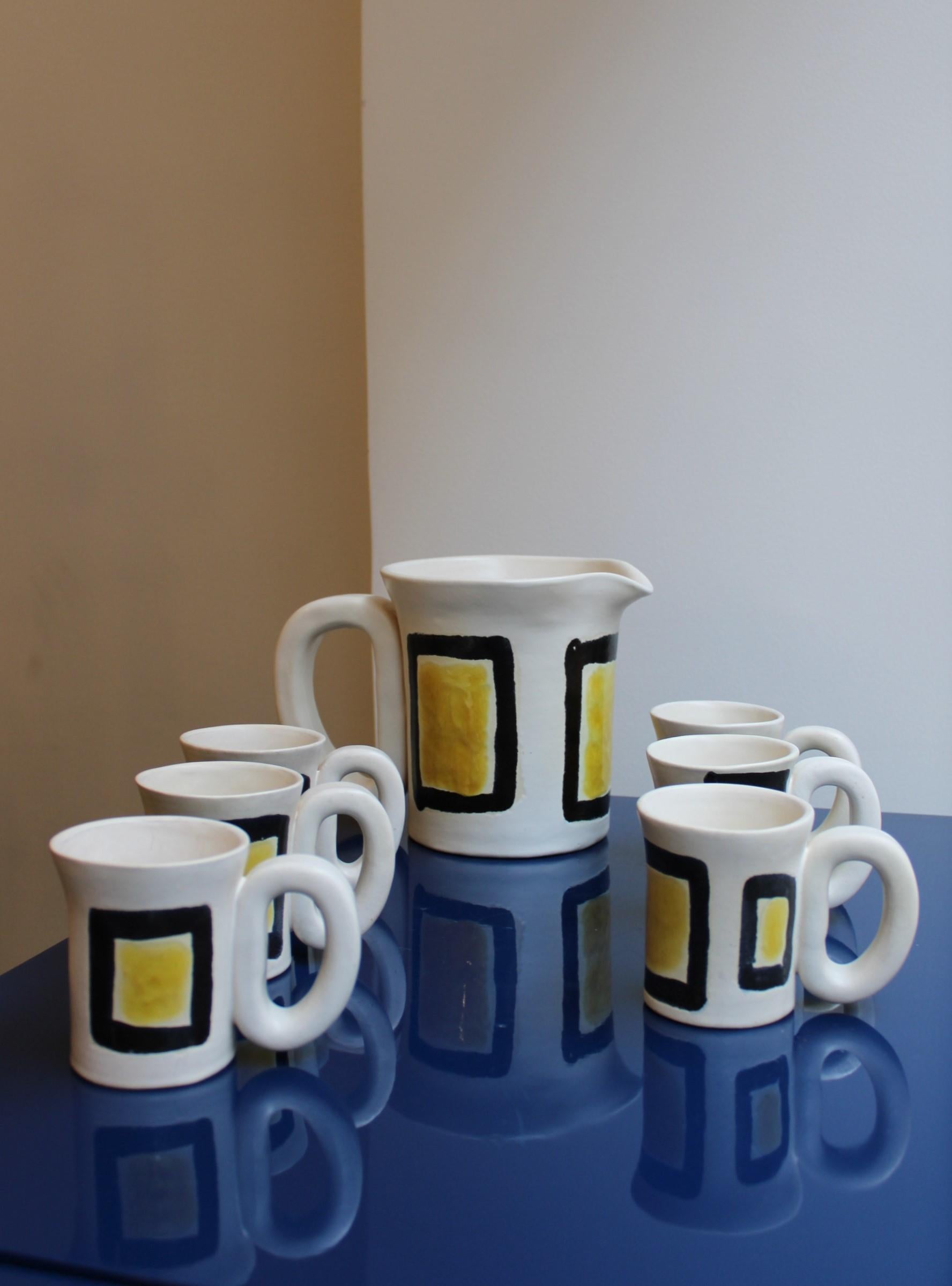 Ceramic set by Jean and Robert Cloutier
Signed under the bases
France, 20th century

Pitcher dimensions : 25 x 16 x 17 cm
Mug dimensions : 12.5 x 8 x H 9 cm