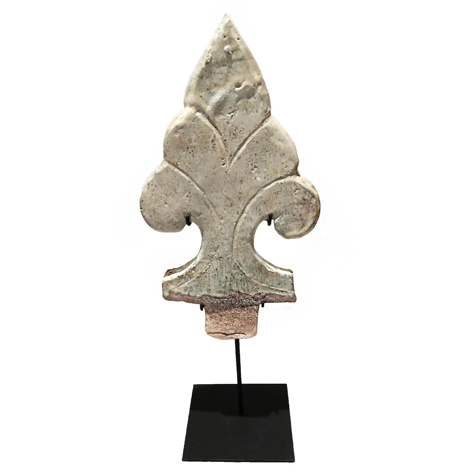 A shield-shaped antefix from Thailand, early 19th century. 

Reclaimed from old constructions and preserved in time, these architectural details were a decorative staple in many traditional Thai buildings, particularly temples, pagodas and homes.