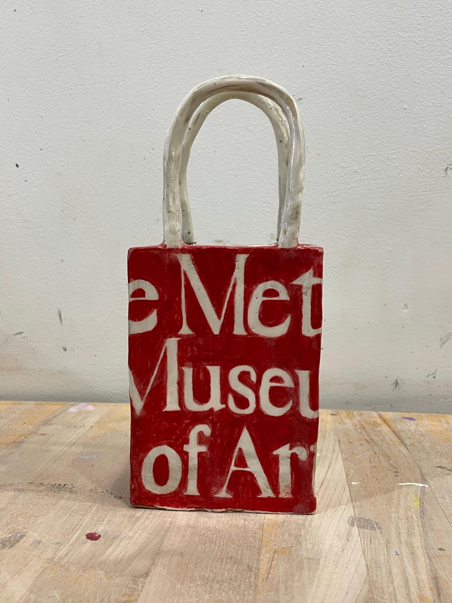 An homage to the iconic museum, this ceramic vessel creates a pop of color and invokes a sense of NYC nostalgia. It can be used as a vase, a penholder, or a decorative accent for any shelf or table. It is sealed with glaze and therefore waterproof.