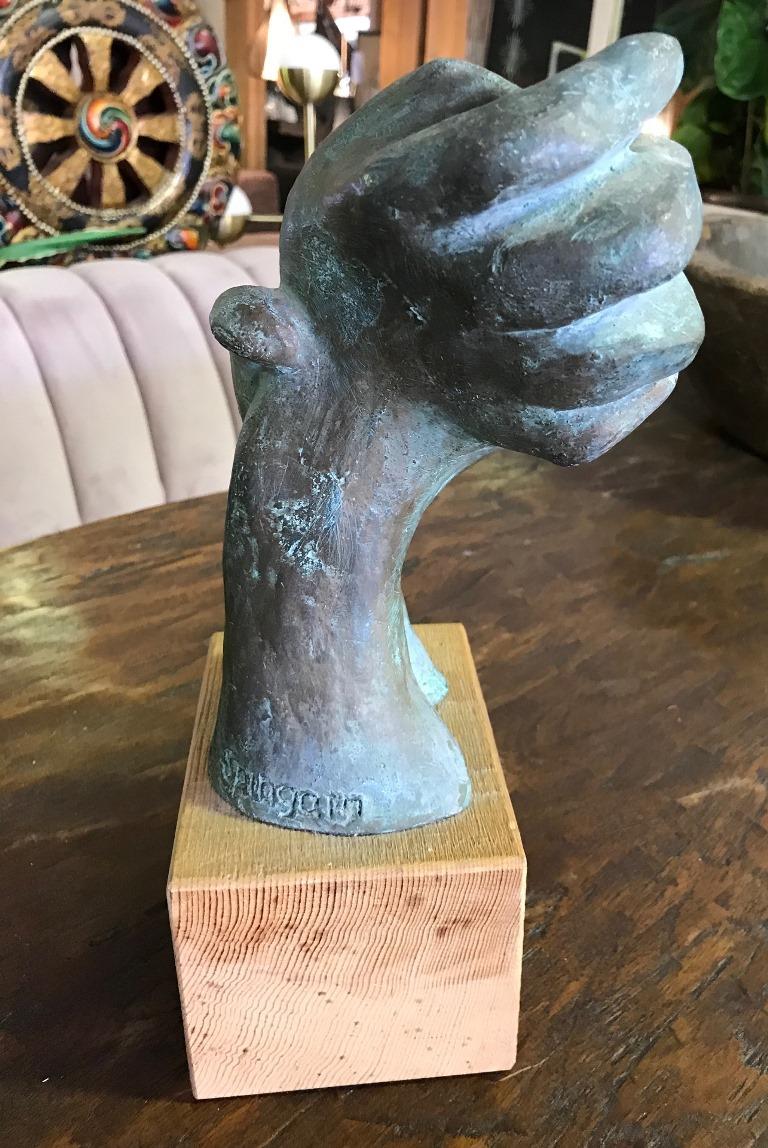 Great piece. Unusual in both color and design. Quite hefty for its size. The sculpture is attached to a wooden display base.

Signed by the artist.

Certainly stands out.

Dimensions: 12.5