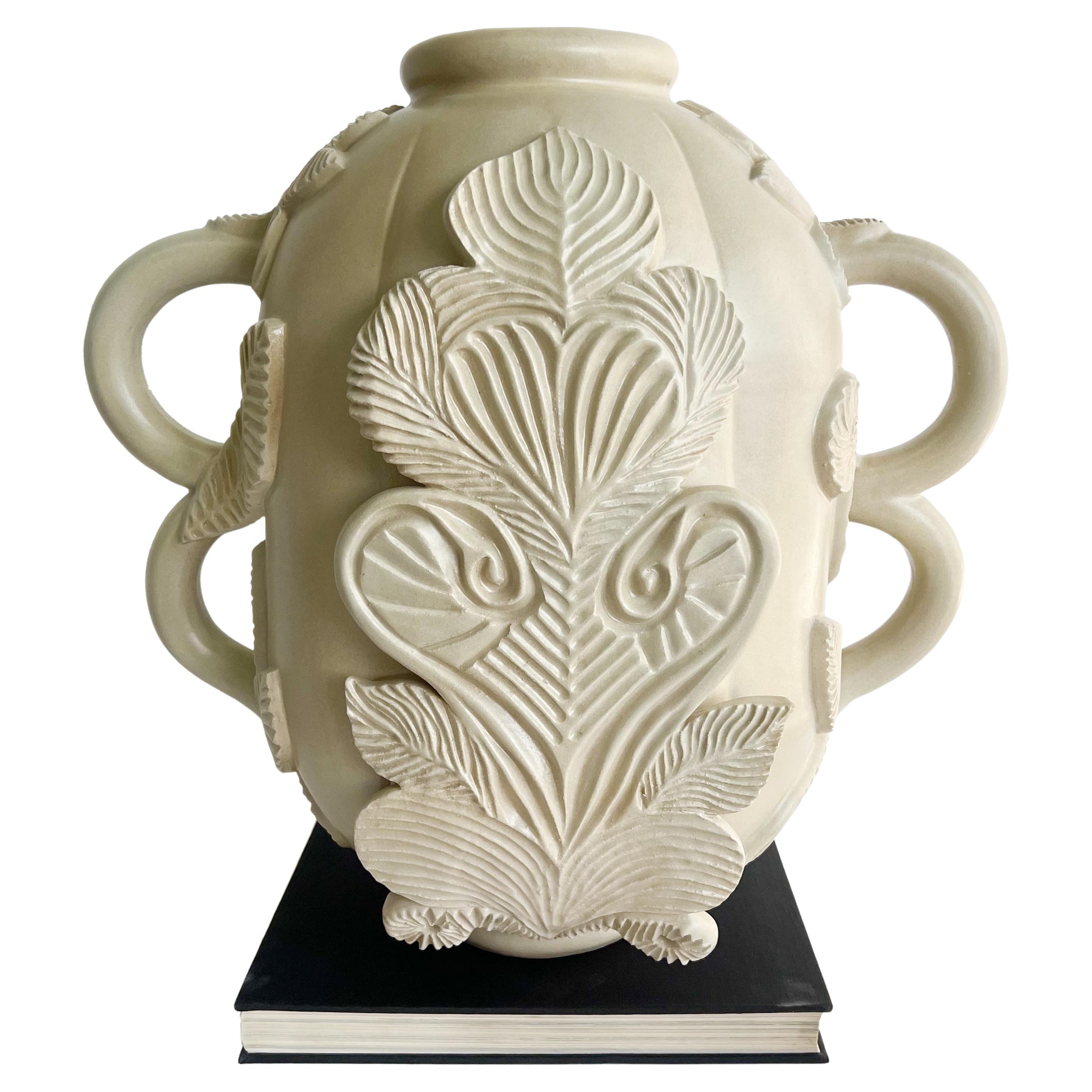 One of a kind, hand sculpted and carved ceramic stoneware sculptural vessel by Keavy Murphree. This sturdy and substantial vase is inspired by the architectural style of Louis Sullivan. Robust double handles are adorned with carved leaves and a