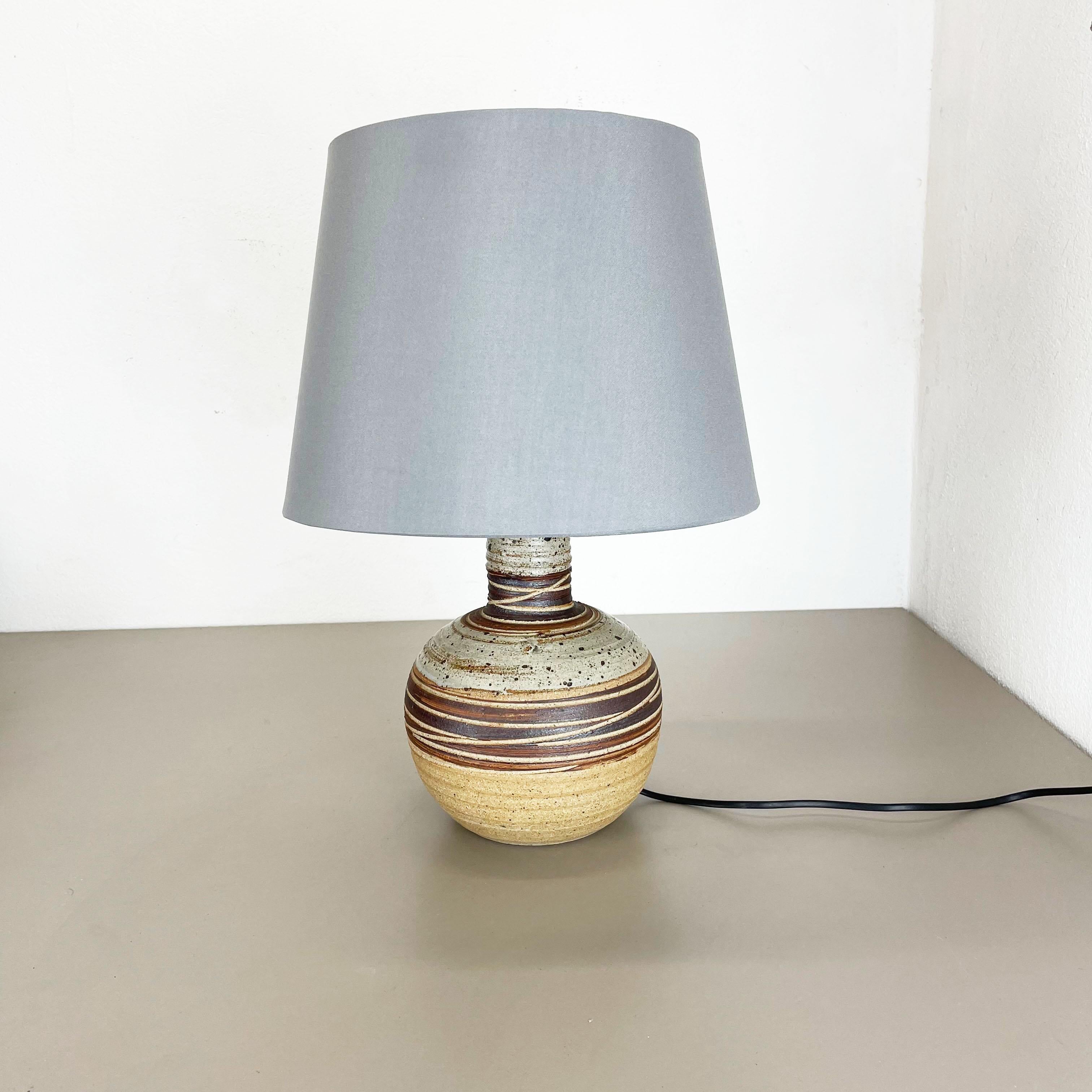 Article:

Ceramic table light base


Producer:

Tue Poulsen, Denmark




Decade:

1970s





This original vintage ceramic Pottery light base was designed and produced by Tue Poulsen in Denmark in the 1970s. It is made of solid