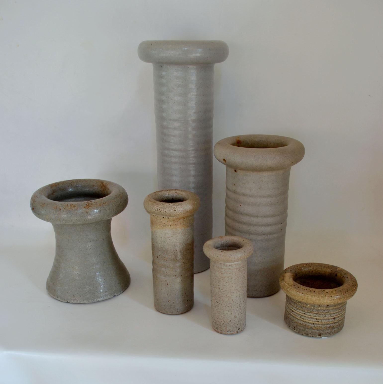 Six cylinder Studio Pottery vases of various heights in white tones created on the turning wheel by the highly technical skilled Dutch ceramist Piet Knepper. At Mobach studio were made in the late 1960s and 1970s. Knepper gave a new twist to the
