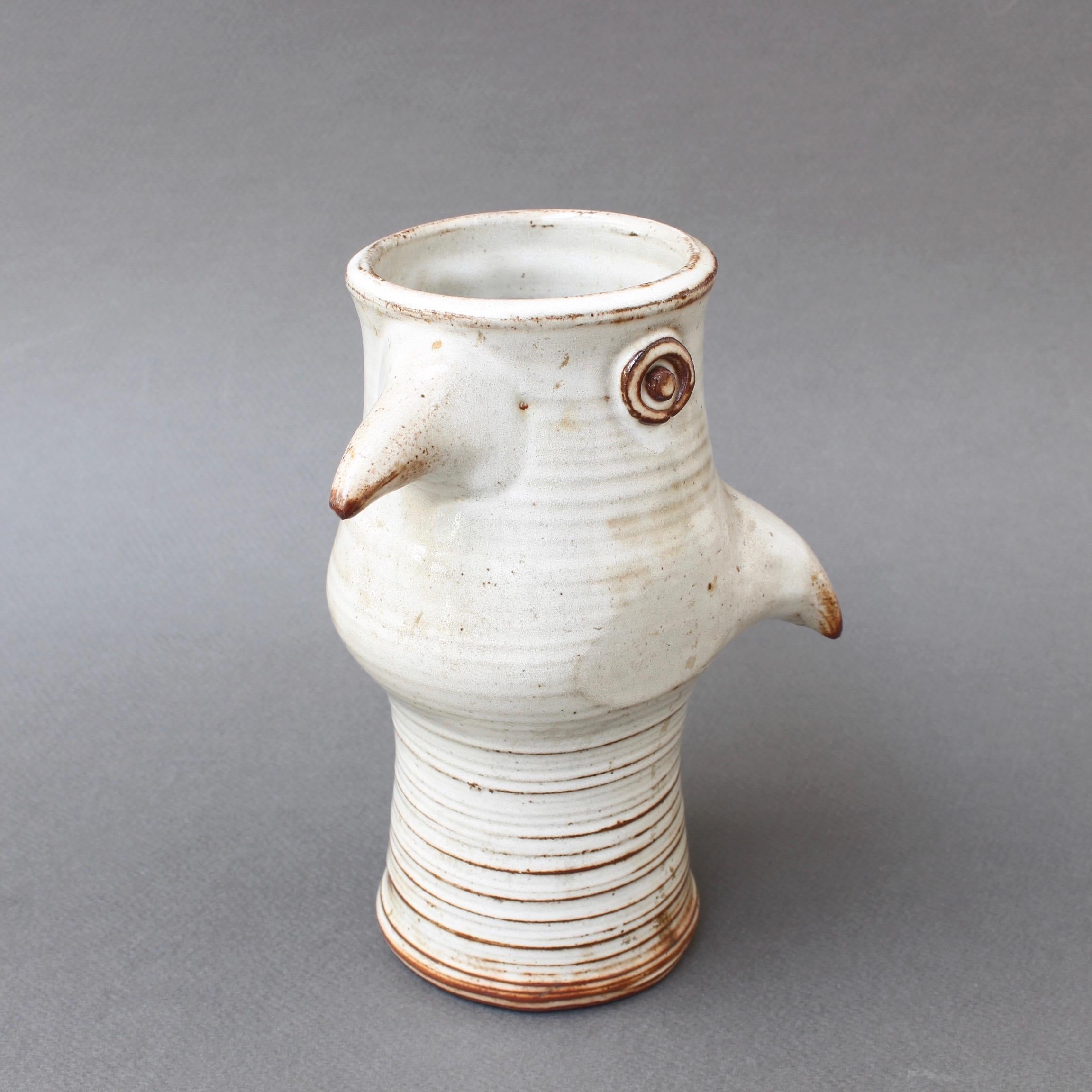 Glazed ceramic, stylized bird vase by Jacques Pouchain (circa 1960s). This is a delightful, sculpted, ceramic vase in Pouchain's inimitable style. The rounded base is decorated with circular, ascending lines and a drip glaze which emanates from the