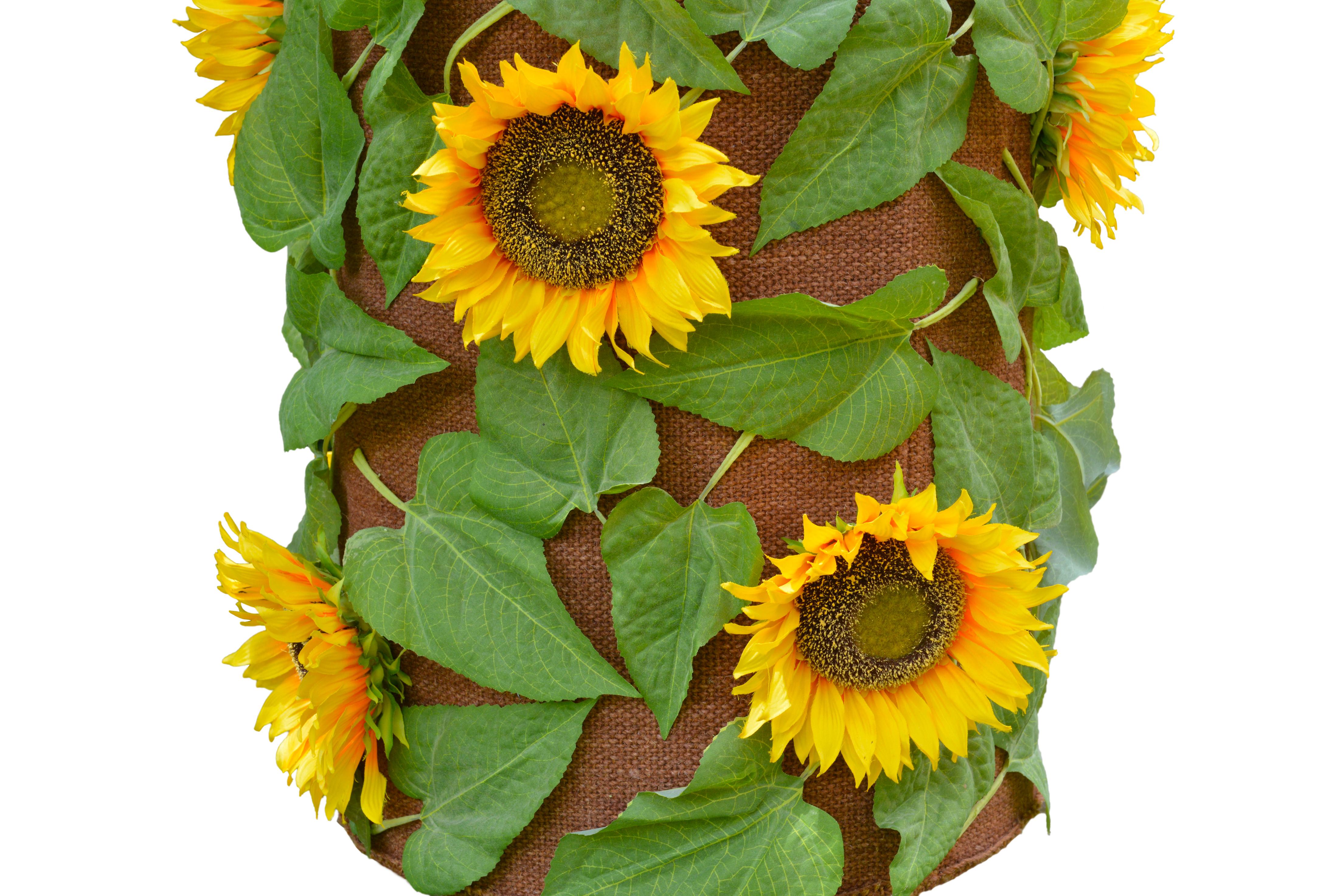 Funky ceramic lamp base with sunflowers, daisies and foliage painted in yellows, oranges, greens and white blues. On the base is a bespoke made brown linen shade with faux sunflower heads and leaves stitched on.