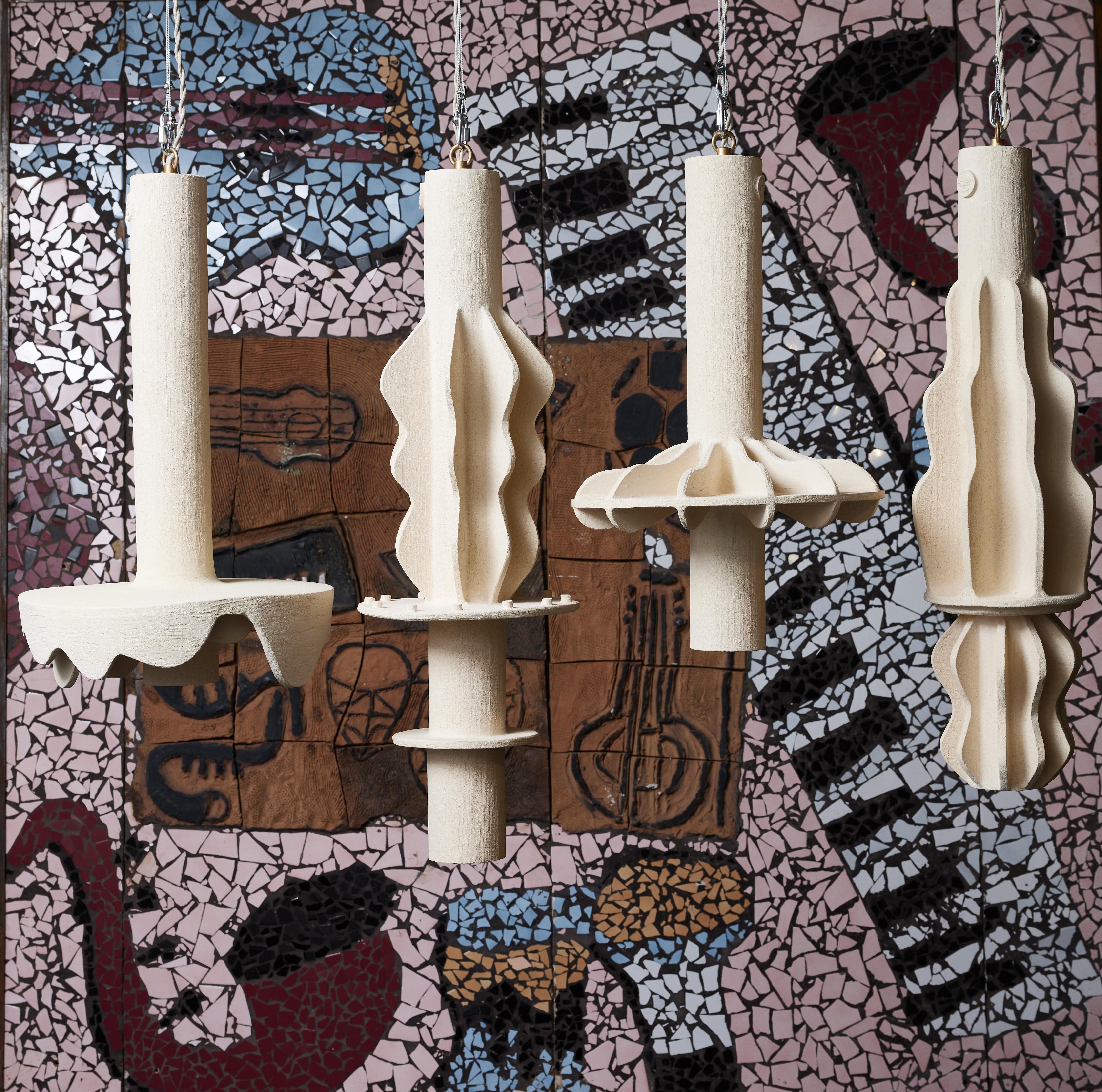 Unique suspensions designed and made by the french contemporary ceramist Olivia Cognet.

Each suspension has a similar cylindrical shape, then decorated with several shapes and motifs.

One source of light per fixture.

Since moving to Los Angeles