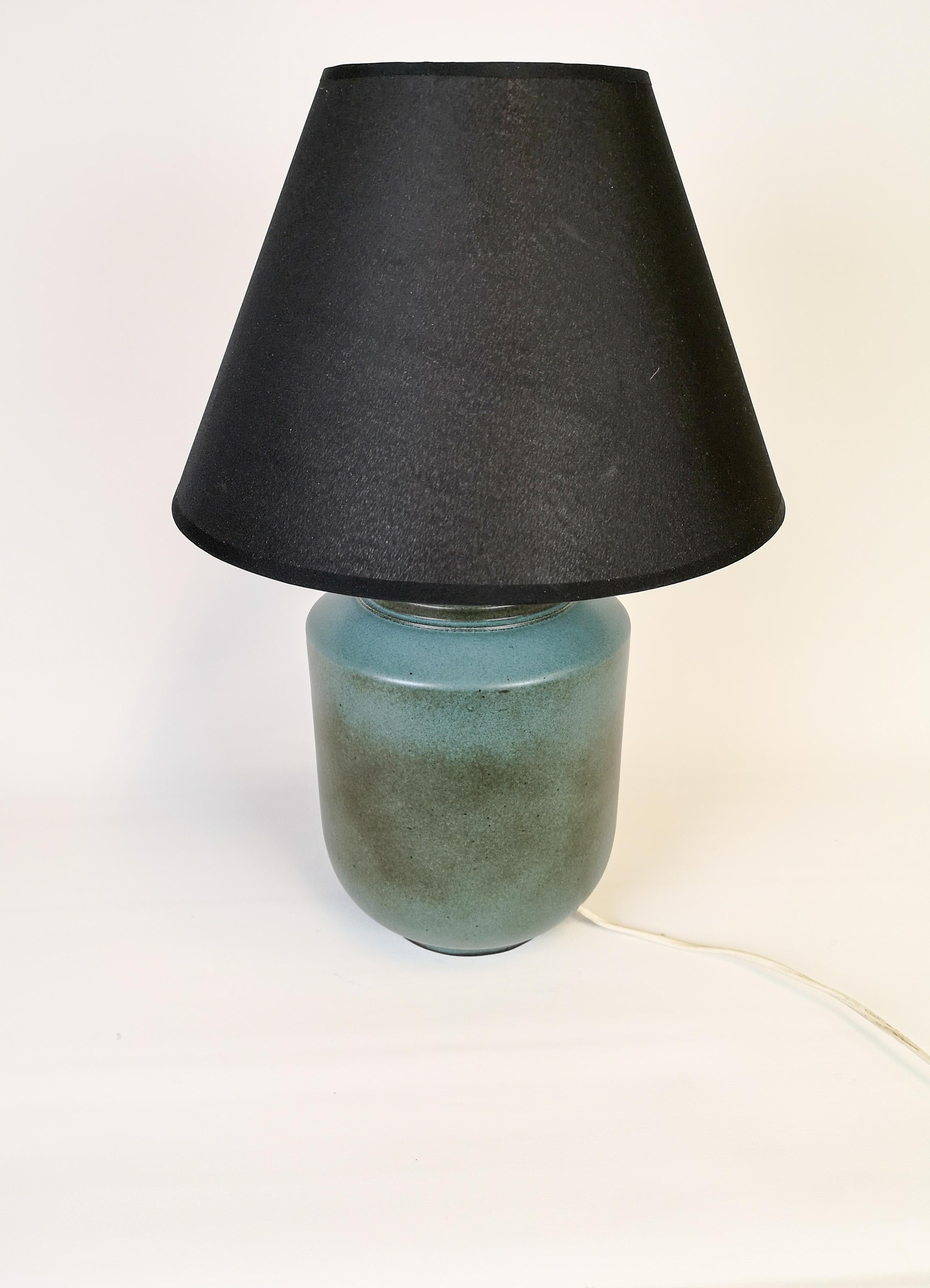 Ceramic table lamp by Gunnar Nylund for Rörstrand, Sweden. The colors of the glaze have a very nice look. This ceramic lamp piece is a rare one to find. 

Good working condition.

Measures: H 30 cm with shade 40 cm D 18 cm.