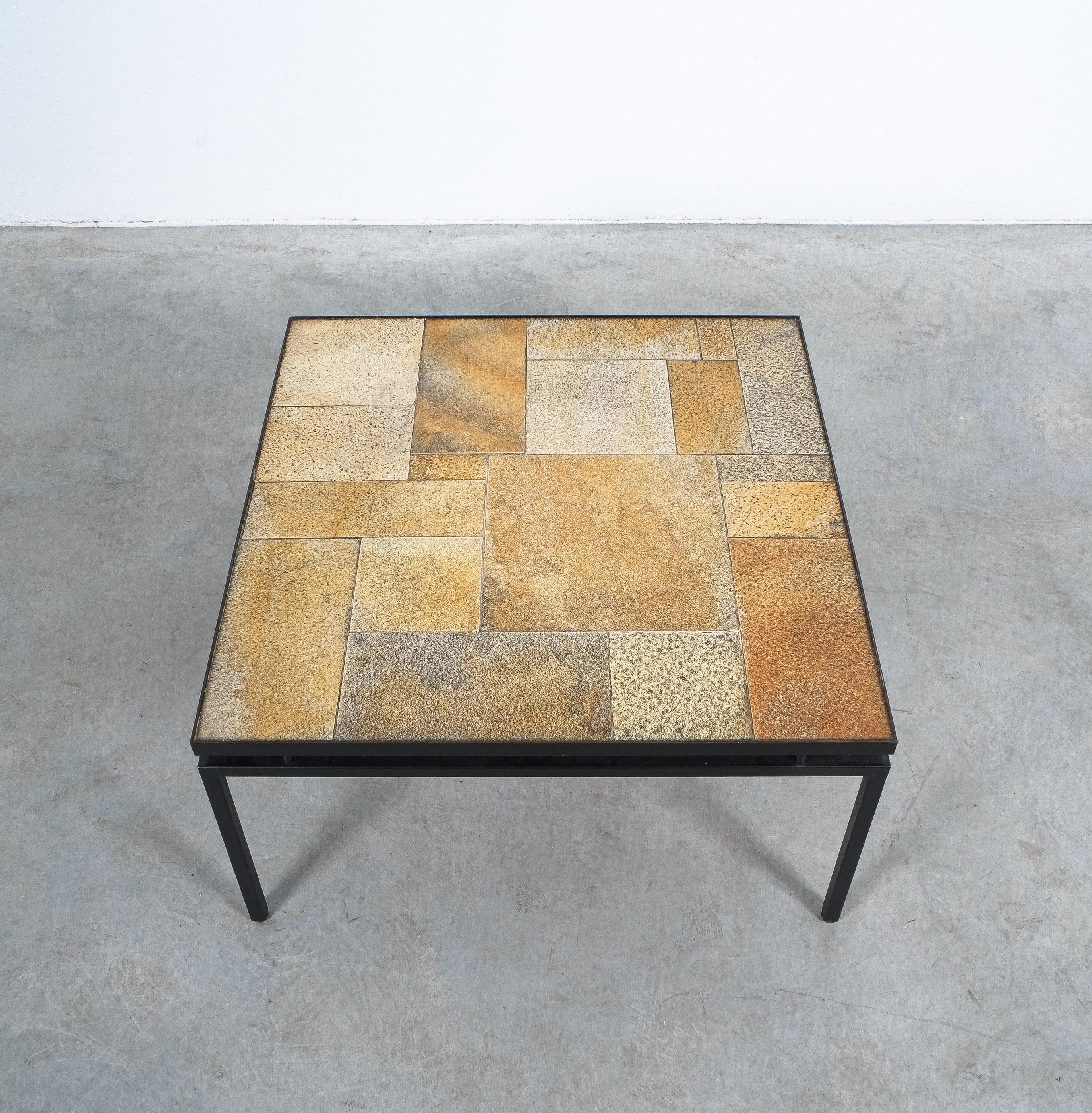Ceramic table attributed Rogier Vandeweghe for Amphora, Belgium circa 1970

A very well balanced and harmonic table from ceramic tiles in good condition. The table top sits on a floating black lacquered iron frame. Handcrafted and in very good
