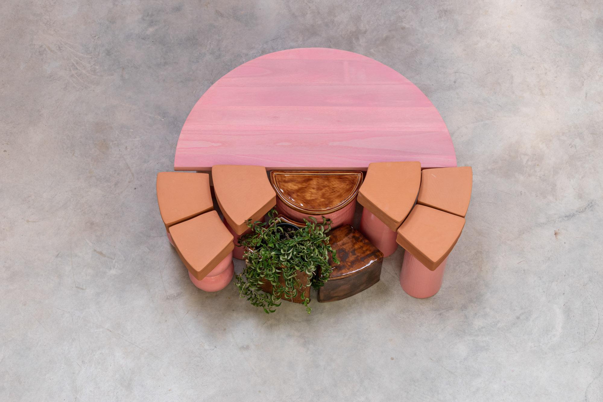 Get a load of this: the Ceramic Table is not your ordinary home decor piece. It's a wild and wacky work of art! We're talking ceramic, terracotta clay, and wood accents all mashed together in 16 bold objects that scream, 