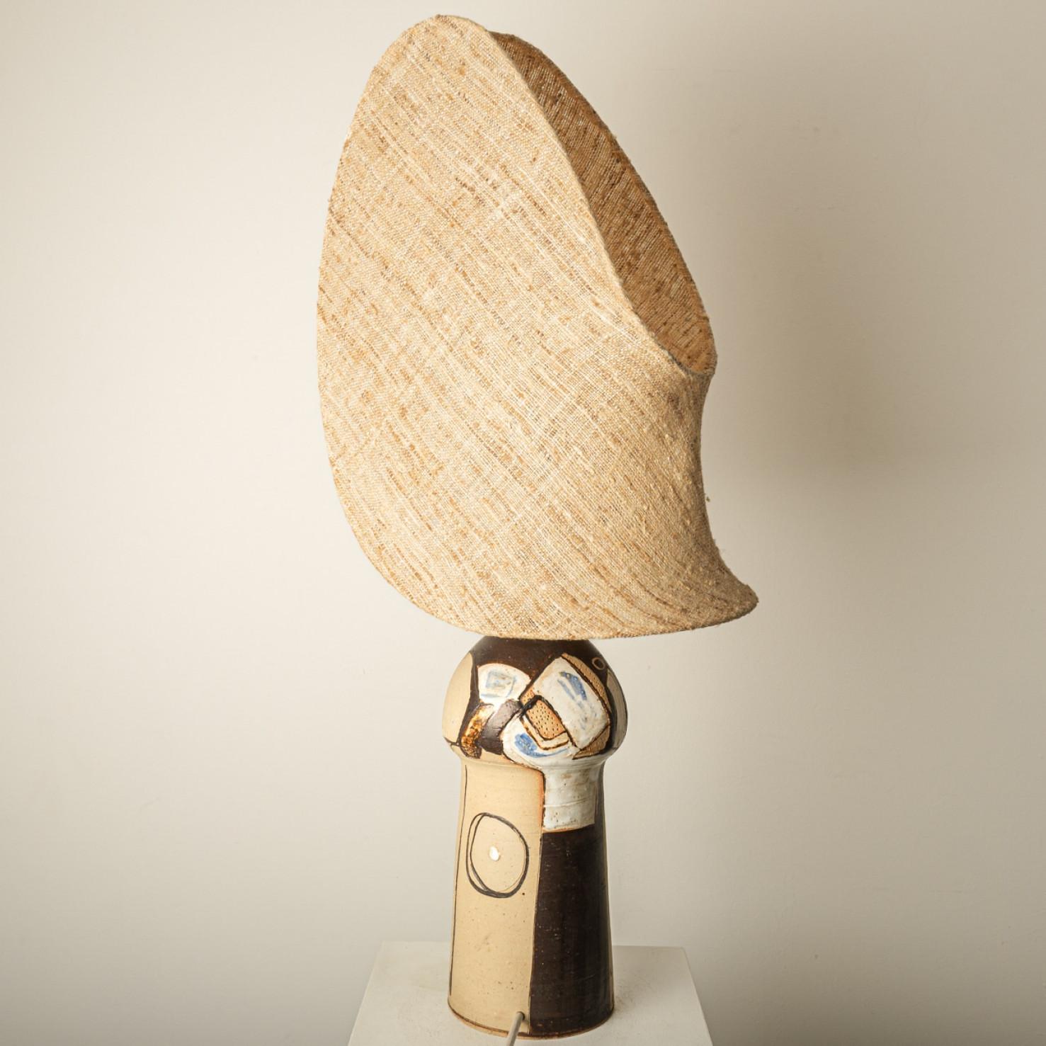 Beautiful ceramic table lamp by Hanne G. Salamon, manufactured in Denmark, 1970. Combined with a rare custom lampshade from Collected by Agnes.

The blue and brown ceramics with the special custom made shade complement each other very well and