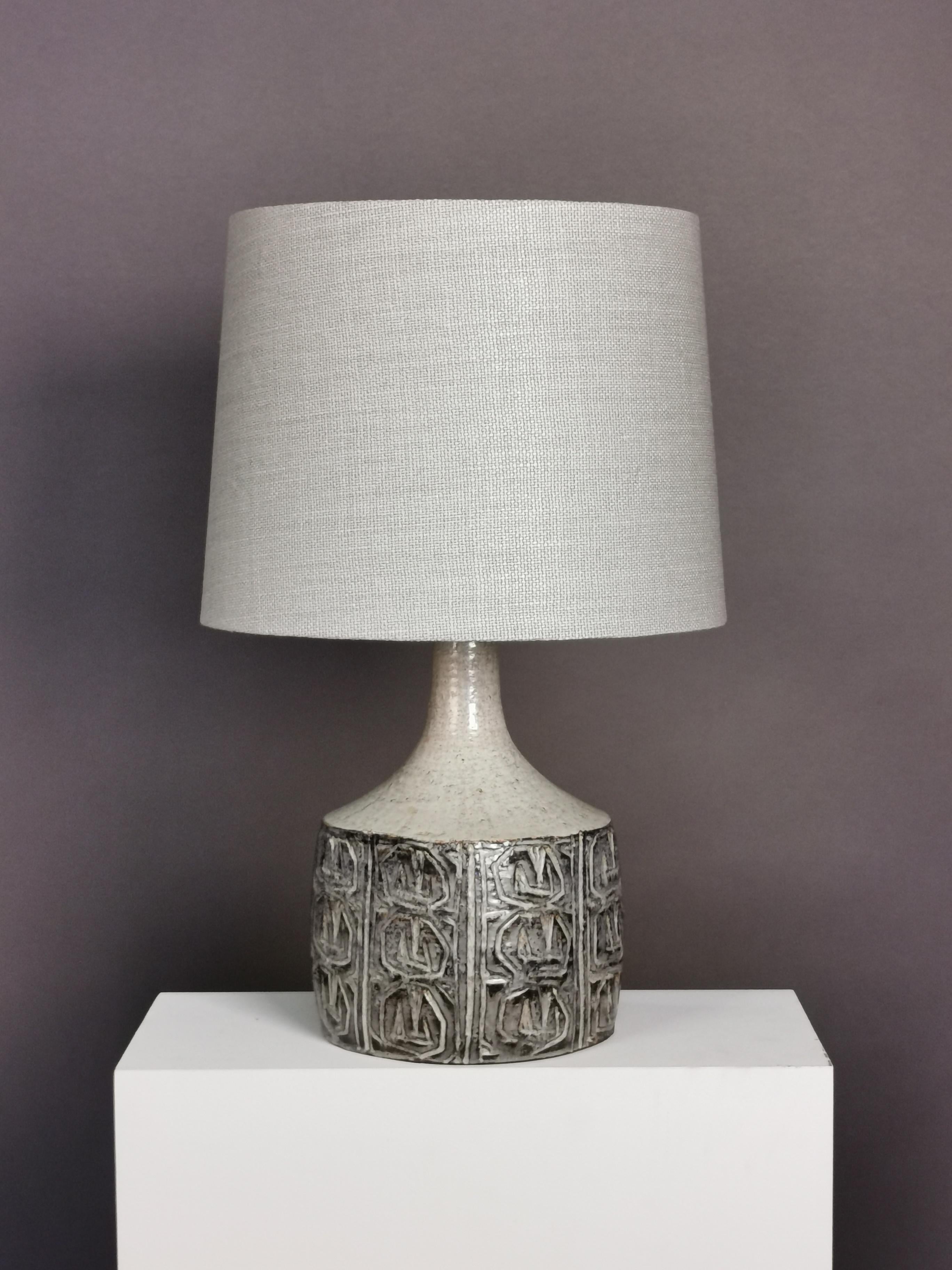 Light grey glazed stoneware table lamp by Danish ceramic artist Jette Hellerøe for Axella.
Manufactured in 1964, new linen shade. Rewired.
The shade diameter is 40cm.
 