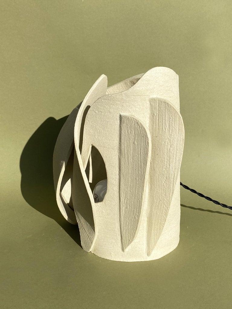 Ceramic table lamp by Olivia Cognet
Materials: Ceramic
Dimensions: around 40-50 cm tall

Available in different sizes, finishes

A new take on the curves of nature in a series of lamps that produce a diffuse light created by a subtle interplay