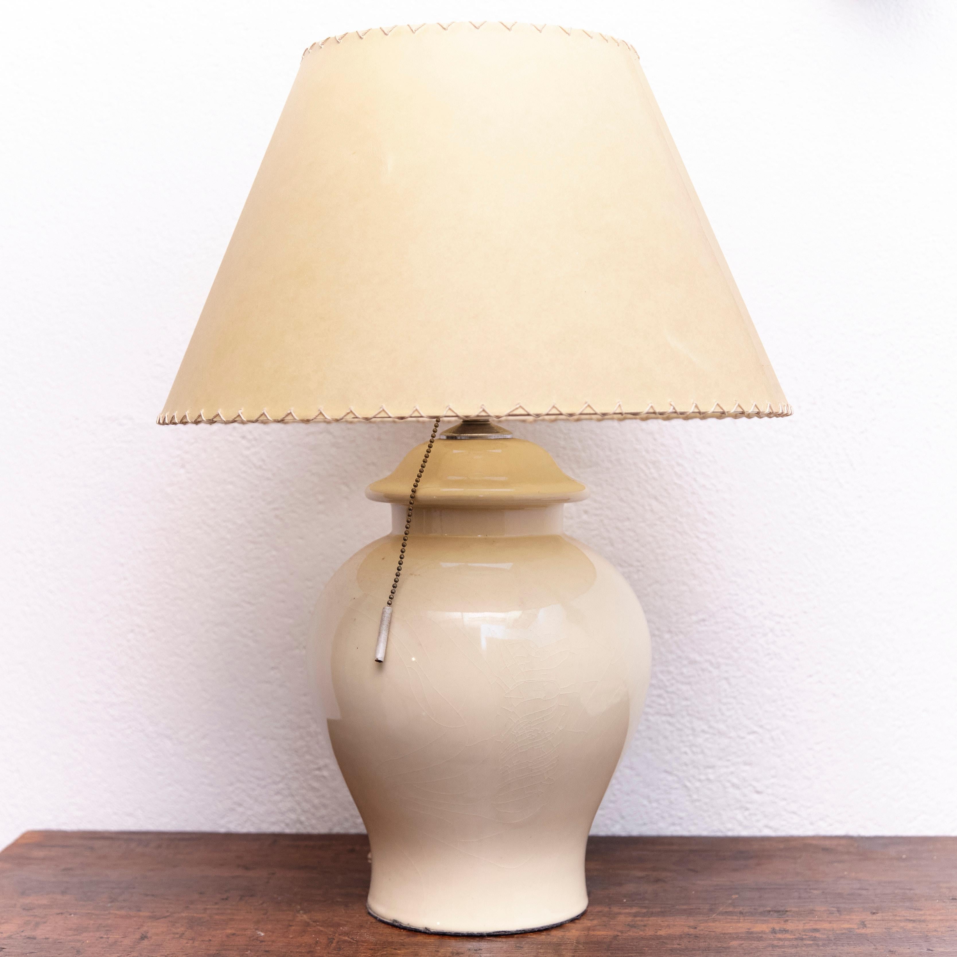 Ceramic vintage table lamp. Made of ceramic with a fabric screen.

Made bay unknown manufacturer in Spain, circa 1960

In original condition, wear consistent with age and use, preserving a beautiful patina.

Materials:
Ceramic
Fabric
Metal.