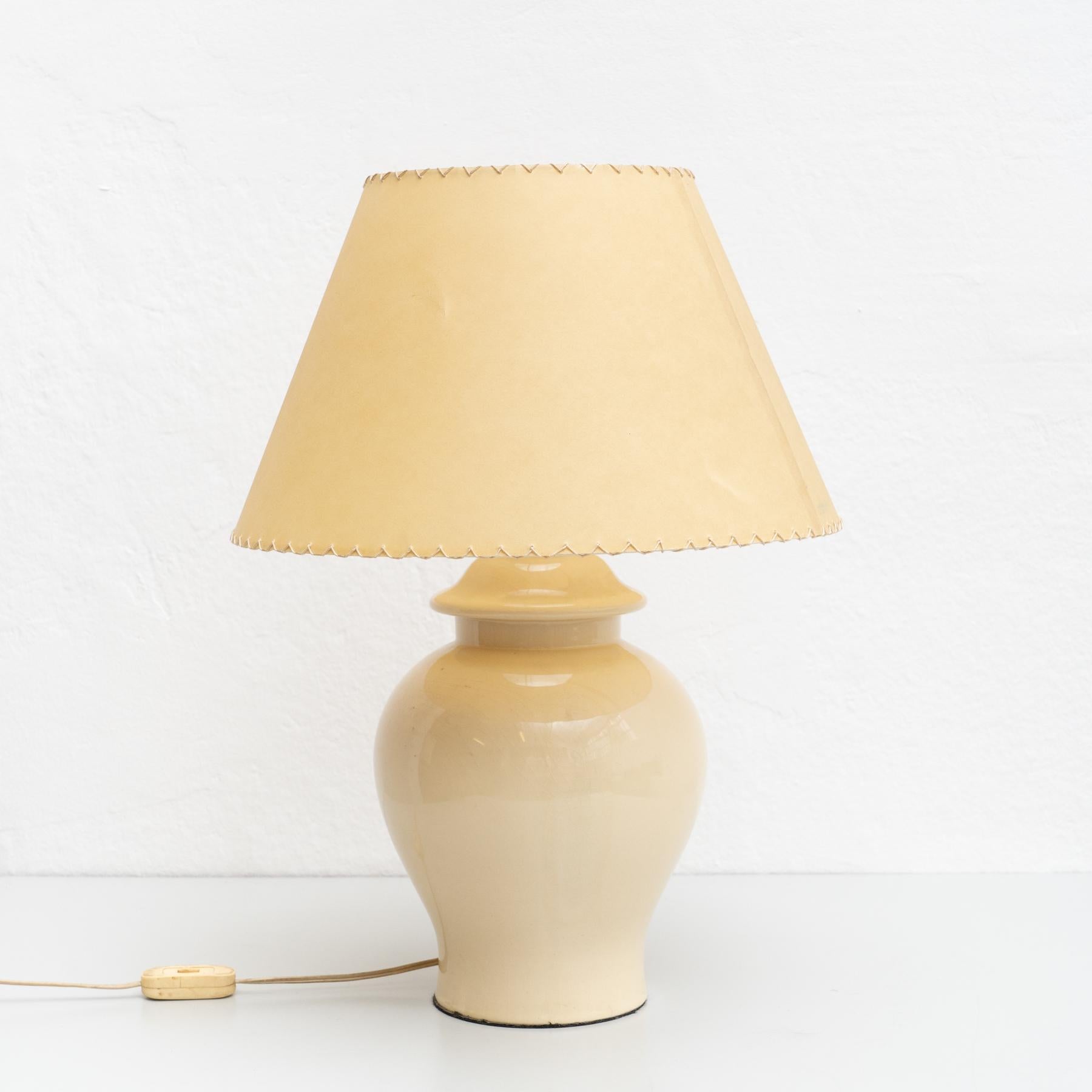 Ceramic vintage table lamp. Made of ceramic with a paper screen.

Made by unknown manufacturer in Spain, circa 1970

In original condition, wear consistent with age and use, preserving a beautiful