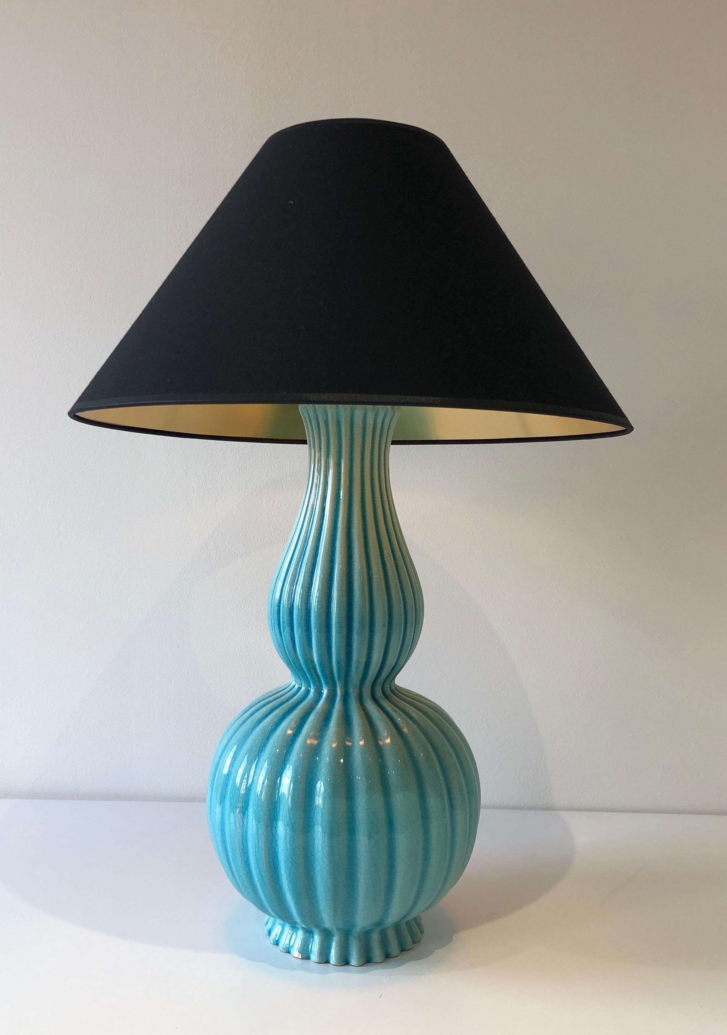 This table lamp is made of a blueish ceramic. This is a very nice work by a French ceramist. Circa 1970.
 